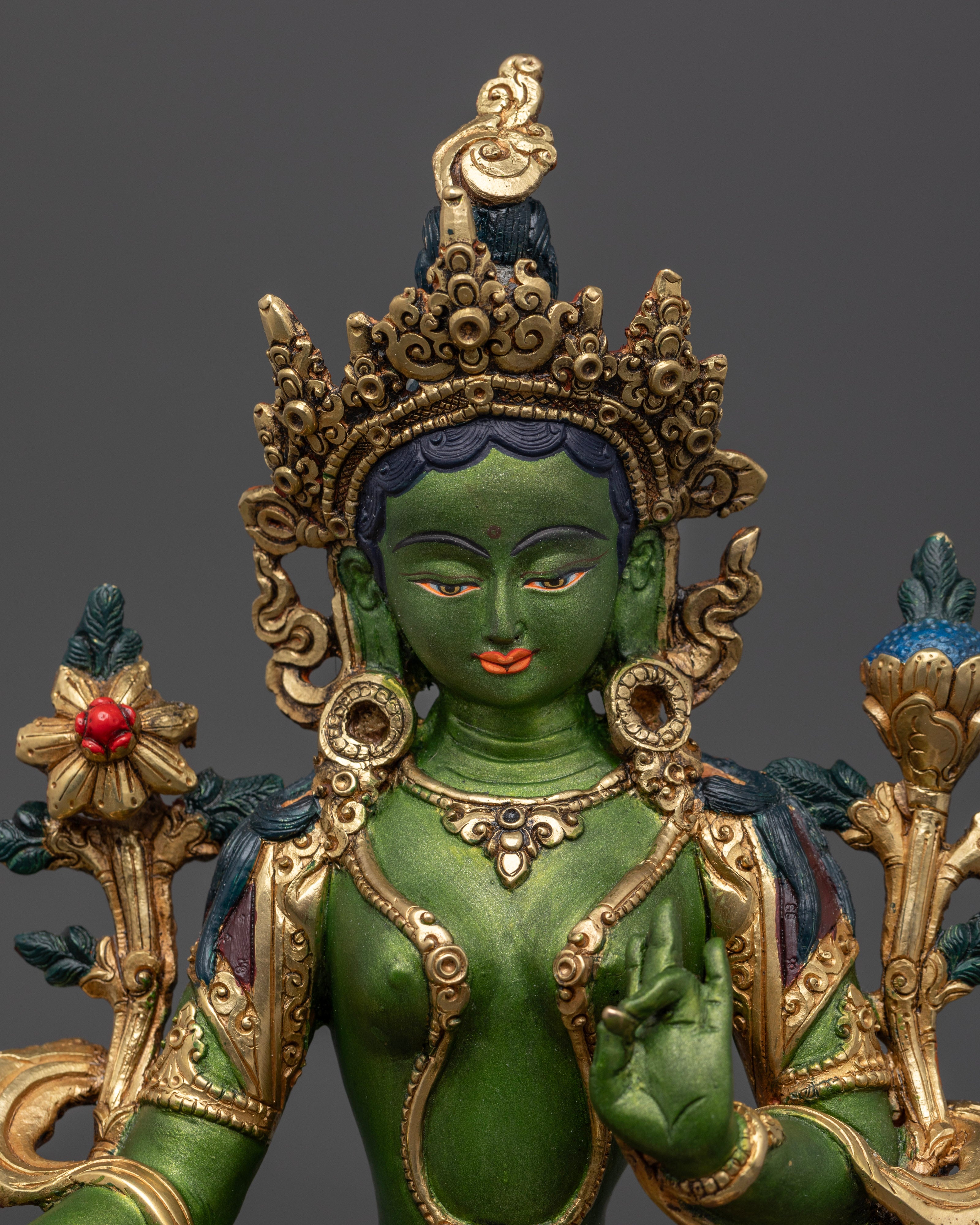 It shows Portrait of Green Tara Statue featuring its intricate details on statue artwork