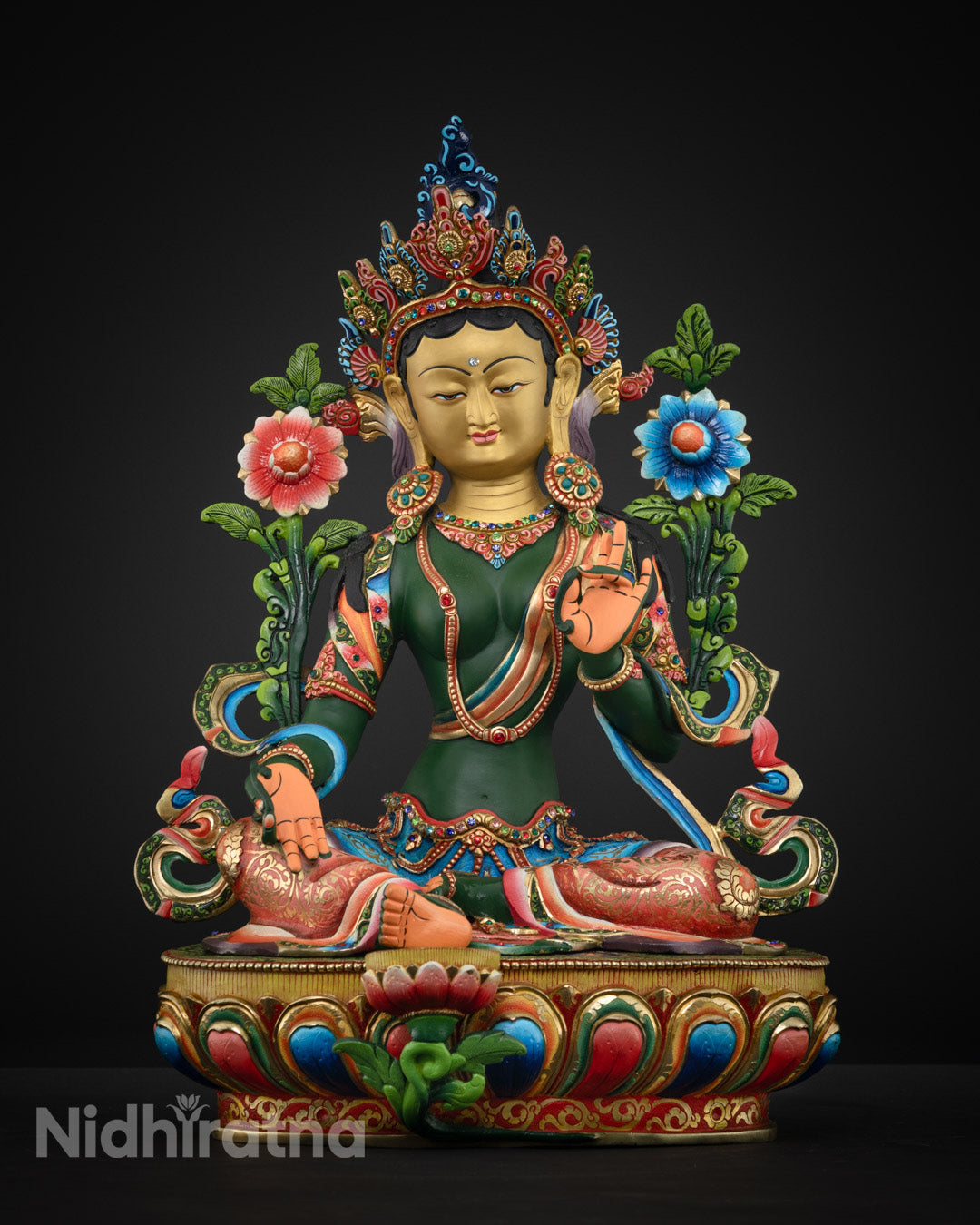 Green Tara statue face with 24k gold plating and gemstone embellishments, highlighting expert Nepalese craftsmanship and spiritual symbolism.