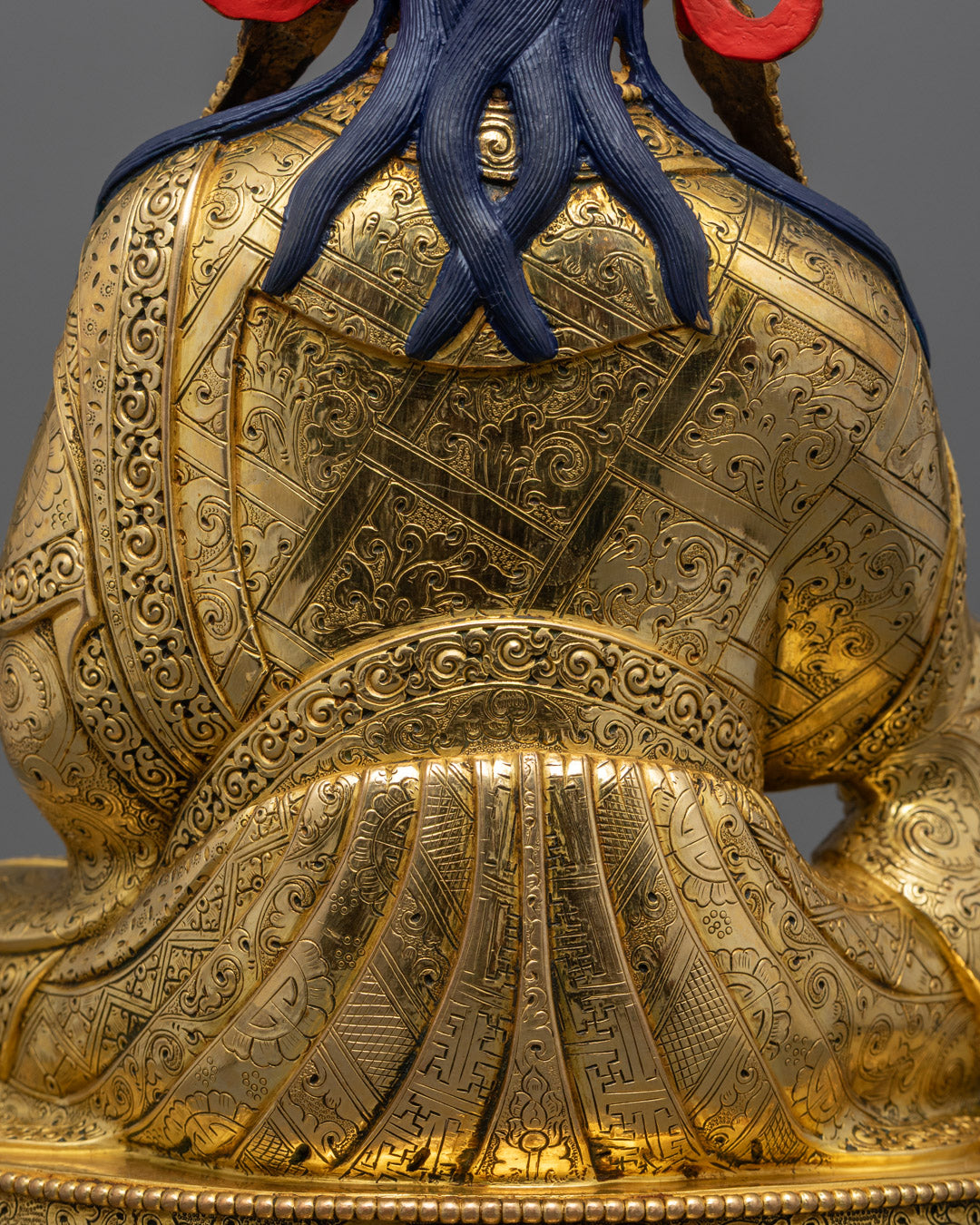 Guru Rinpoche Padmasambhava statue | Tibetan Buddhist figure | lotus-born master, Vajrayana guru, tantric meditation teacher, holding vajra and kapala, seated on lotus throne, rich traditional attire, Himalayan Buddhist icon.