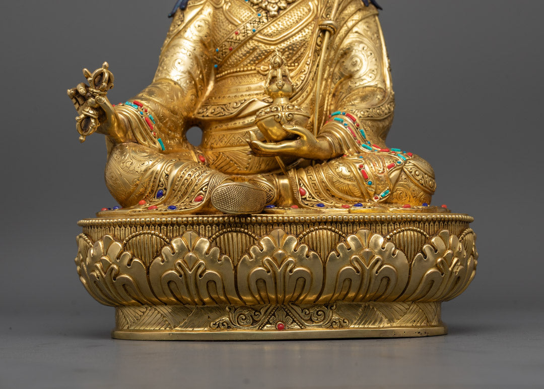 Guru Rinpoche sculpture symbolizing protection and enlightenment, featuring sacred iconography and a hollow chamber for mantra insertion.