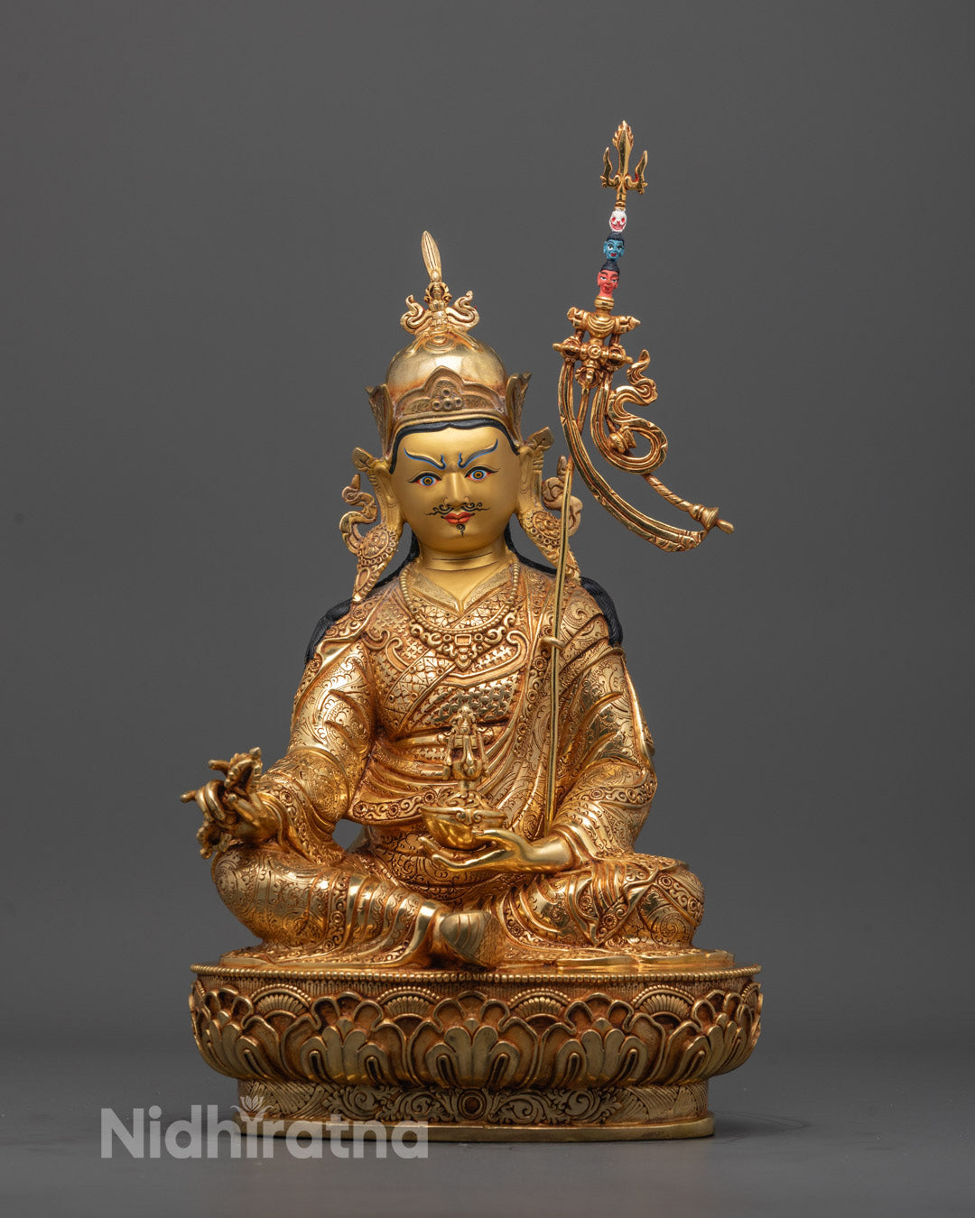 Guru Padmasambhava statue front view with 24K gold-gilded face and intricate carvings