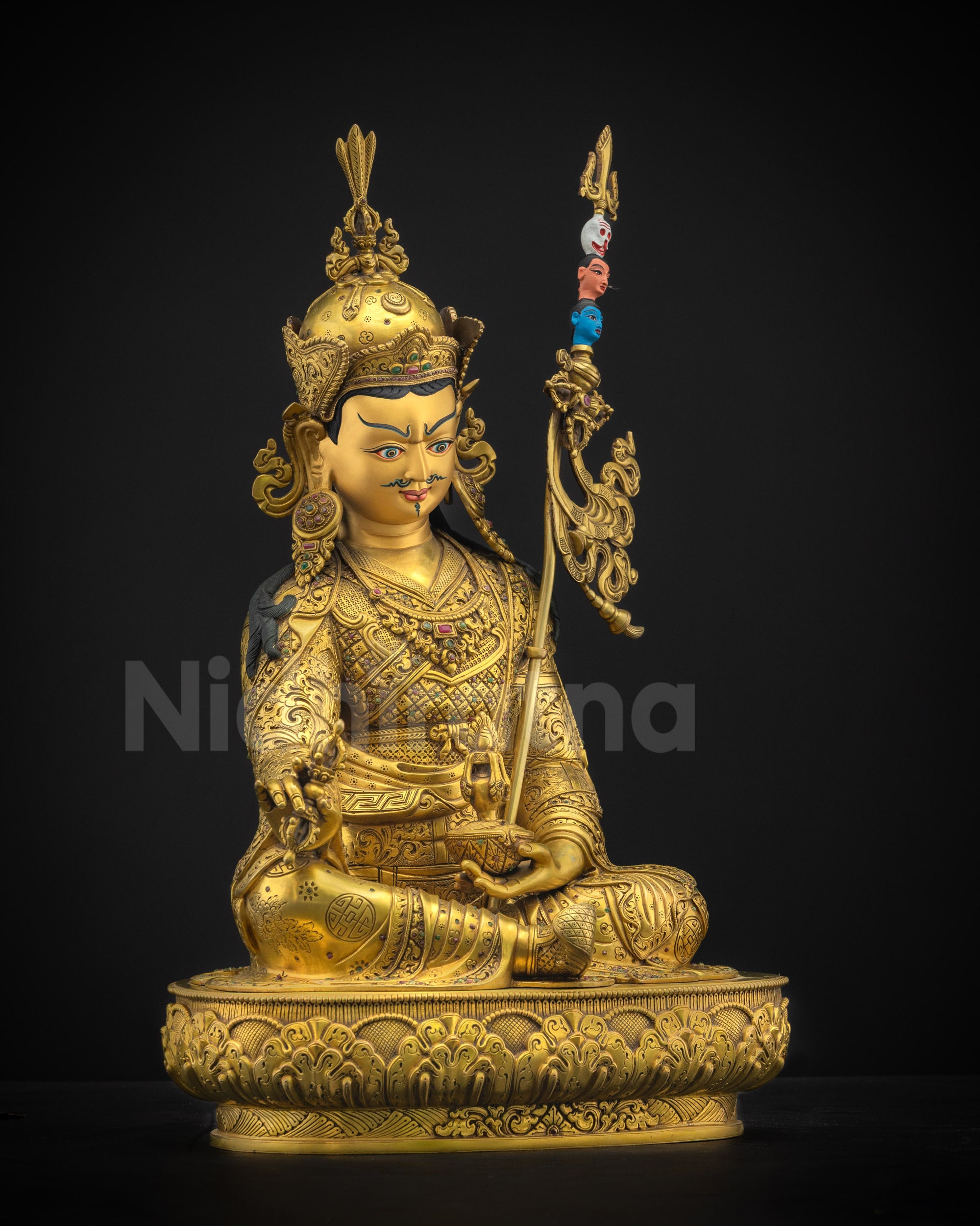 Right side view of Guru Rinpoche sculpture with fire-gilded body, lotus throne, and intricate motifs
