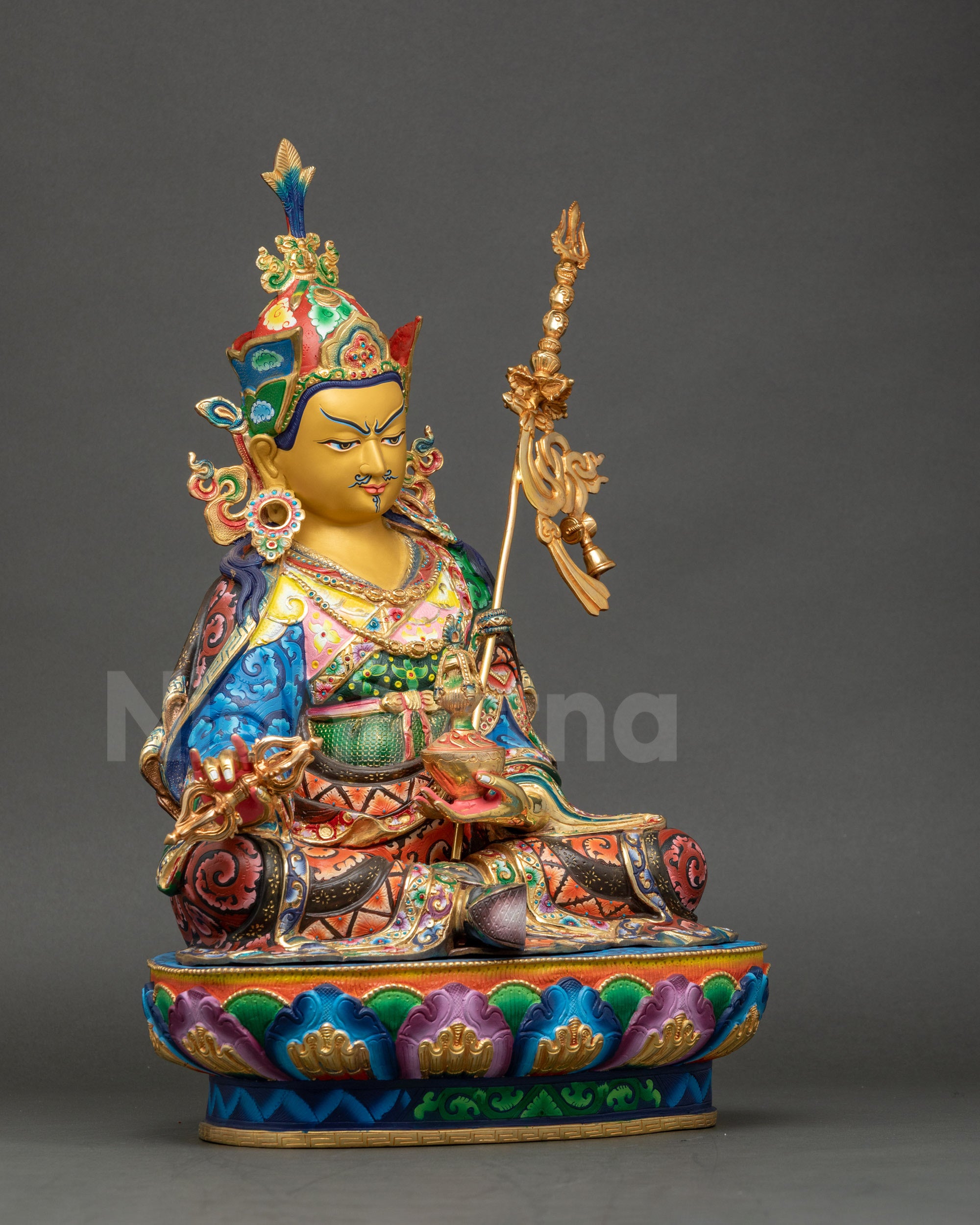 Guru Rinpoche statue left side view showcasing intricate floral motifs