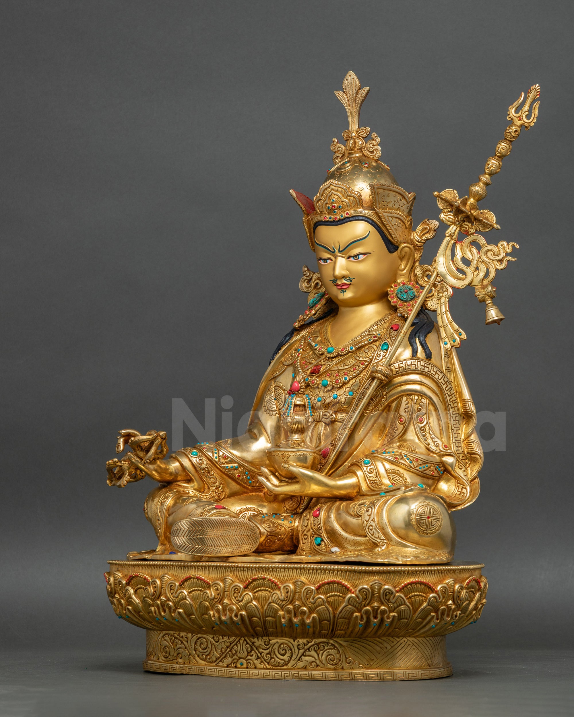 Guru Rinpoche statue left side view with polished monastic robes