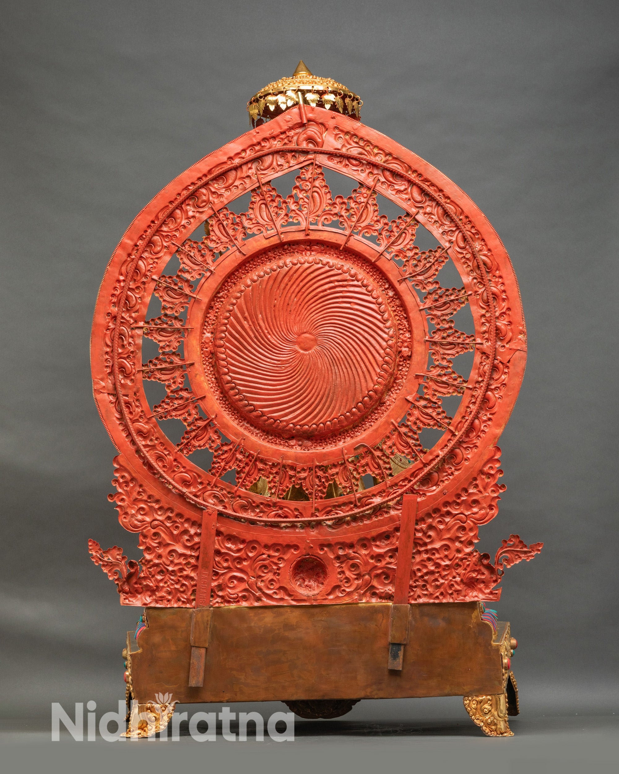 Guru Rinpoche statue viewed from back showing ornate throne rear panel with lion sculptures and golden framework