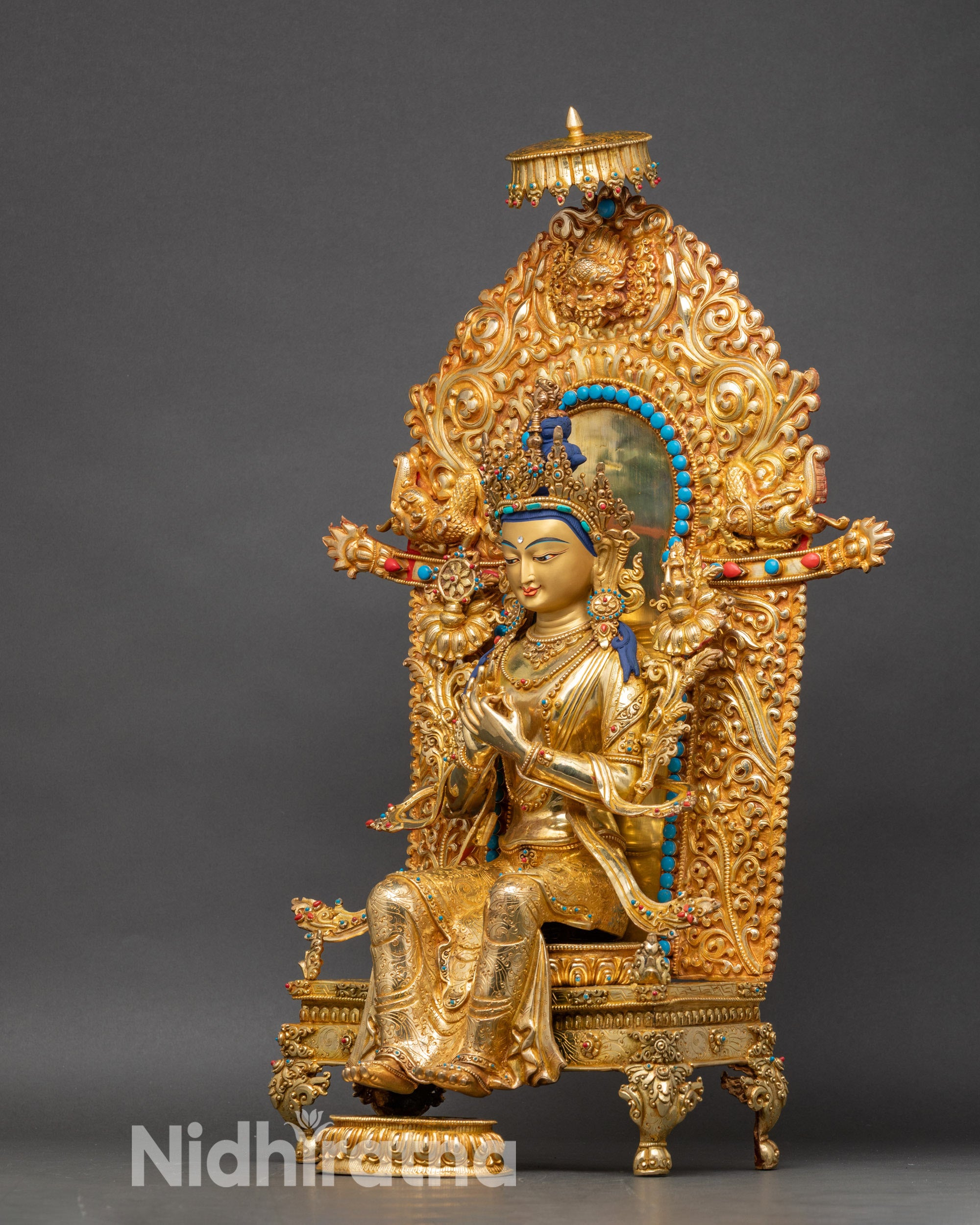 Halo detail of Maitreya Buddha statue with miniature animals, deities, and parasol