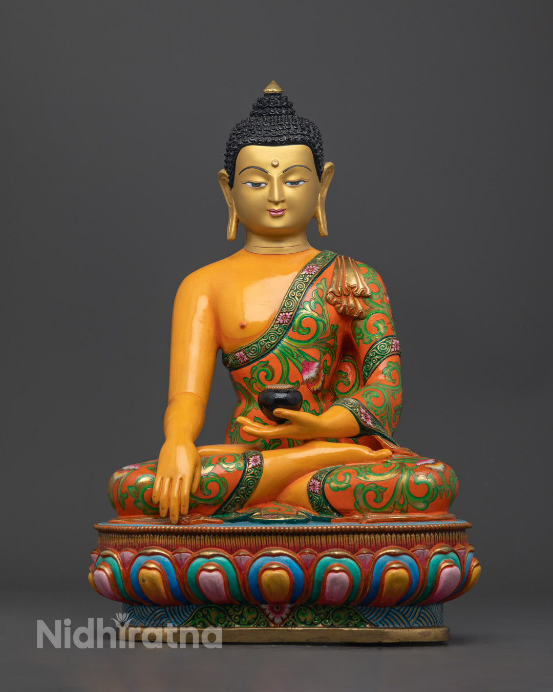 Hand-carved 13.9" Shakyamuni Buddha Statue in premium copper, 24K gold-gilded face, vibrant acrylic colors, on lotus throne, Nepal-crafted.