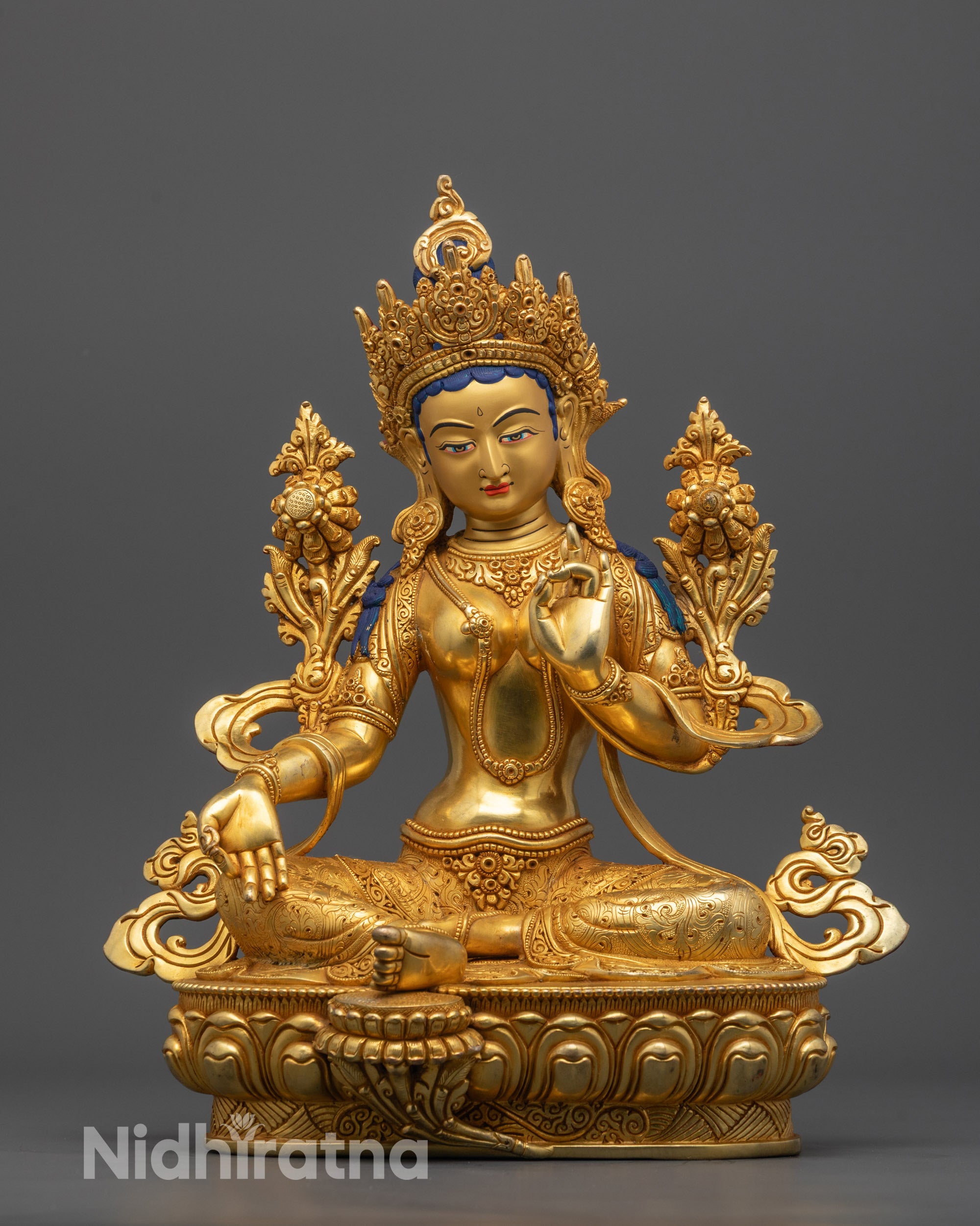 Hand-carved Green Tara Statue from Nepal seated on lotus base in varada mudra