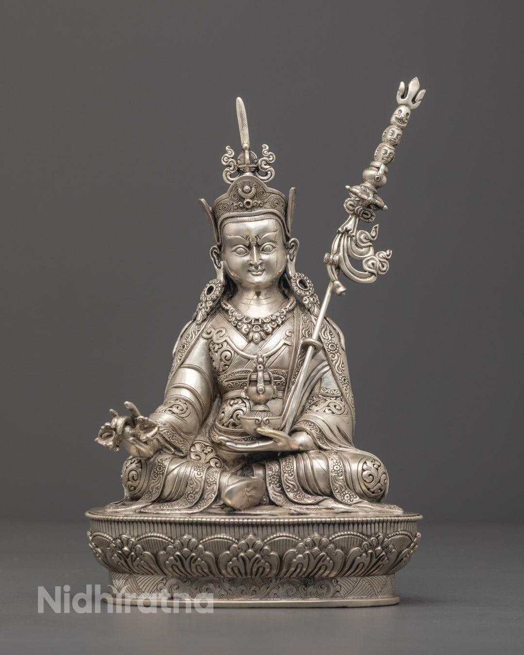 Hand-carved Guru Rinpoche statue with pure silver plating, crafted in Nepal using the lost wax method