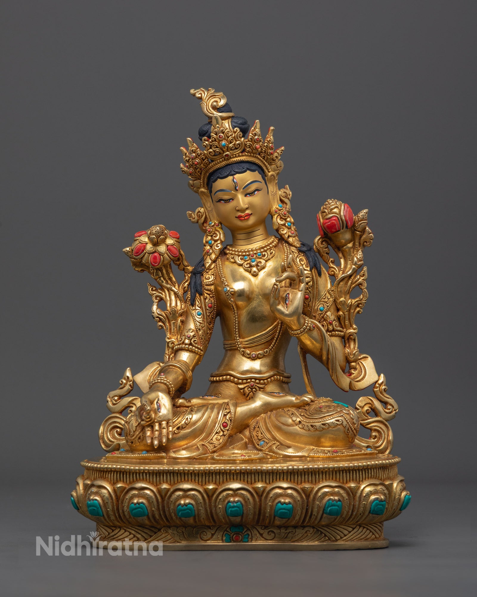 Hand-carved White Tara statue made of copper with 24k gold fire-gilding, detailed with semi-precious stones and yellow acrylic colors.
