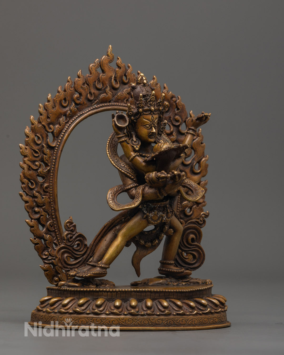 Hand-painted Chakrasamvara statue with crossed hands holding vajra and bell, vibrant acrylic colors highlighting details
