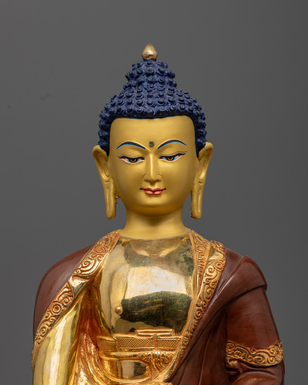 Hand-painted Shakyamuni Buddha statue with rich acrylic colors and radiant gold-gilded face by fire-gilding technique