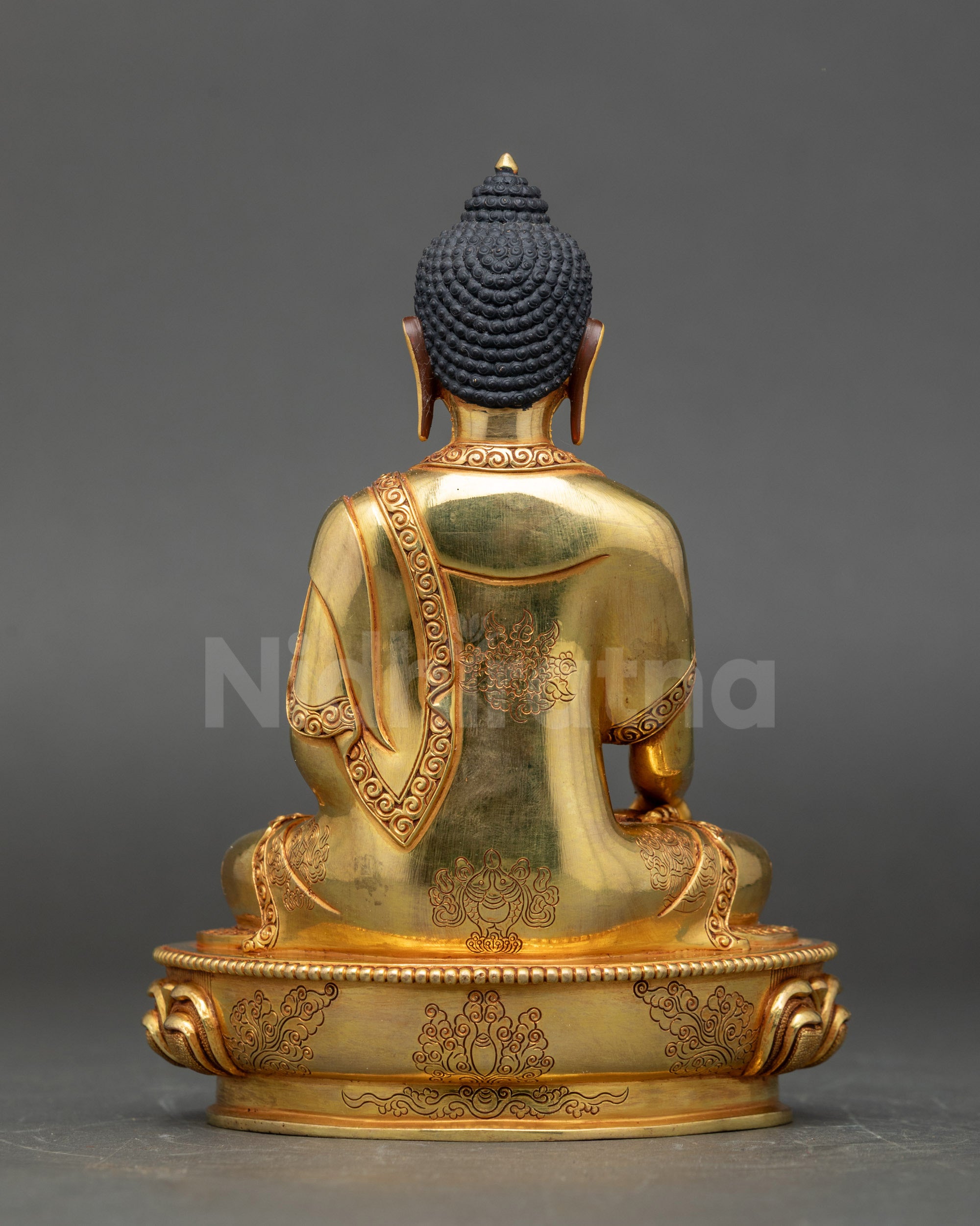 Handcrafted Buddha figurine with detailed lotus base and serene expression