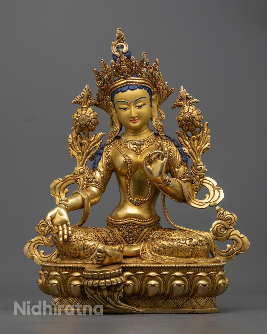 Handcrafted Green Tara Statue with 24K gold gilding, semi-precious stones, and intricate detailing, symbolizing compassion and protection.