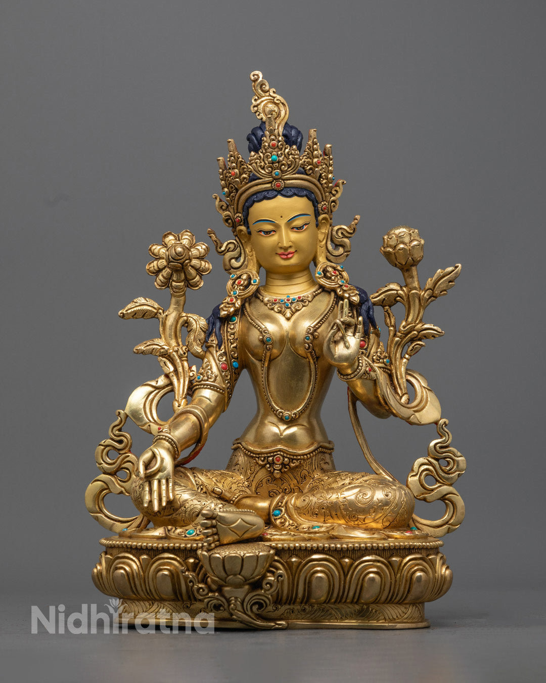 Handcrafted Green Tara Statue with 24K gold gilding and semi-precious stones, representing compassion and protection in vibrant detail.