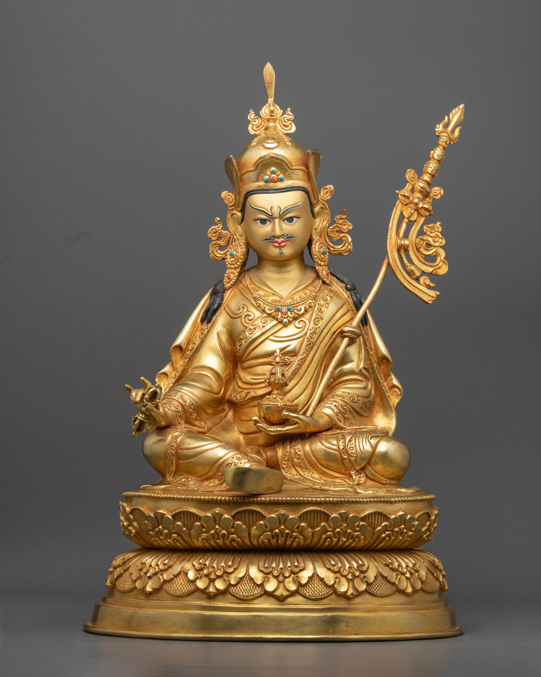 Handcrafted Guru Rinpoche Statue with 24K gold gilded copper, featuring fine details and spiritual symbolism. A sacred representation of Padmasambhava.