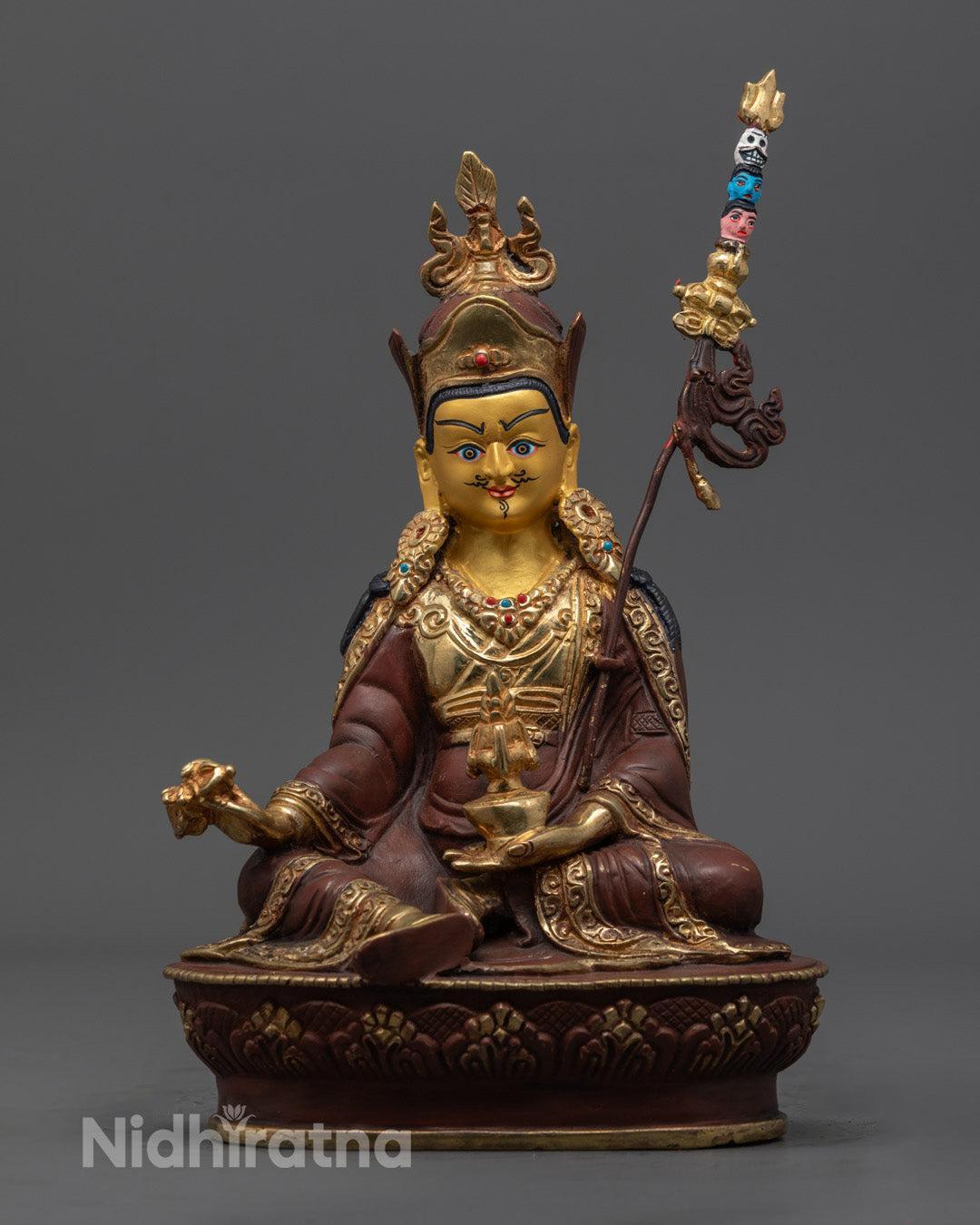 Handcrafted Guru Rinpoche statue with 24K gold-gilded face and fire-gilded body, seated on a lotus throne – Tibetan Padmasambhava spiritual art