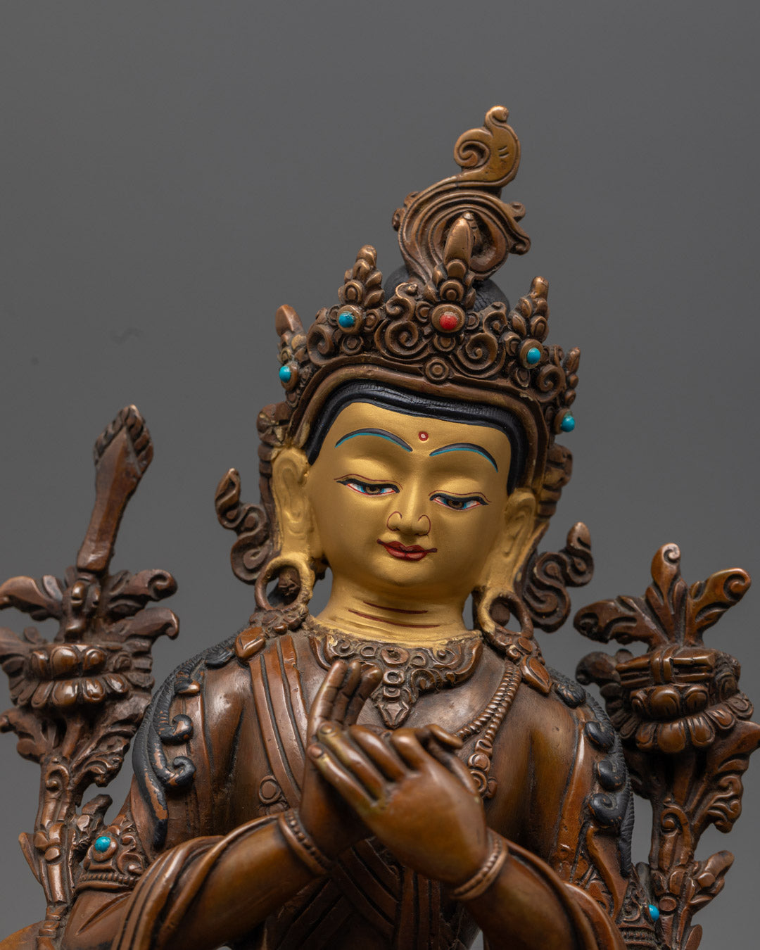 Handcrafted Manjushri Buddha statue adorned with semi-precious stones and acrylic colors