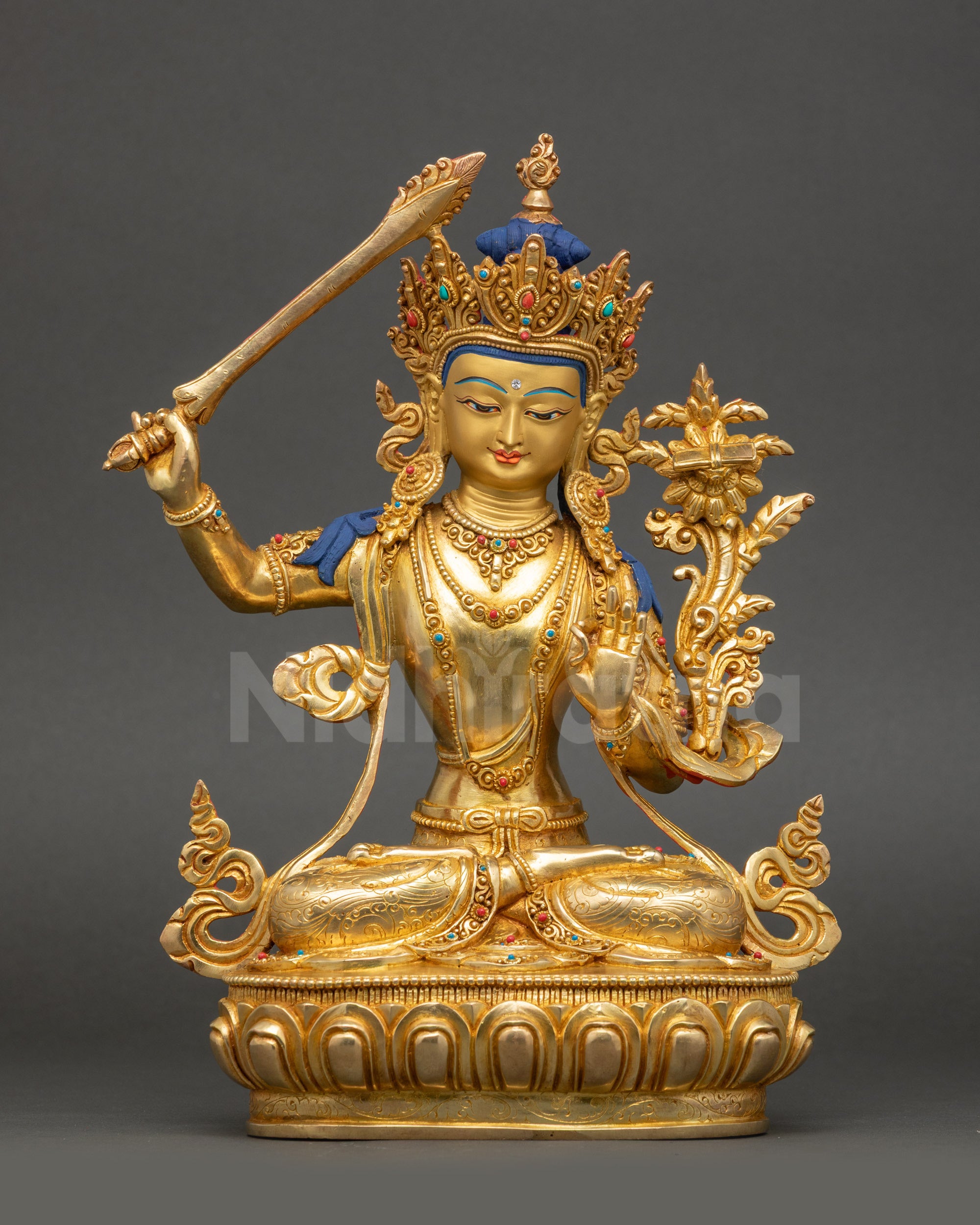 Handcrafted Manjushri statue seated on lotus with gold-gilded face front view