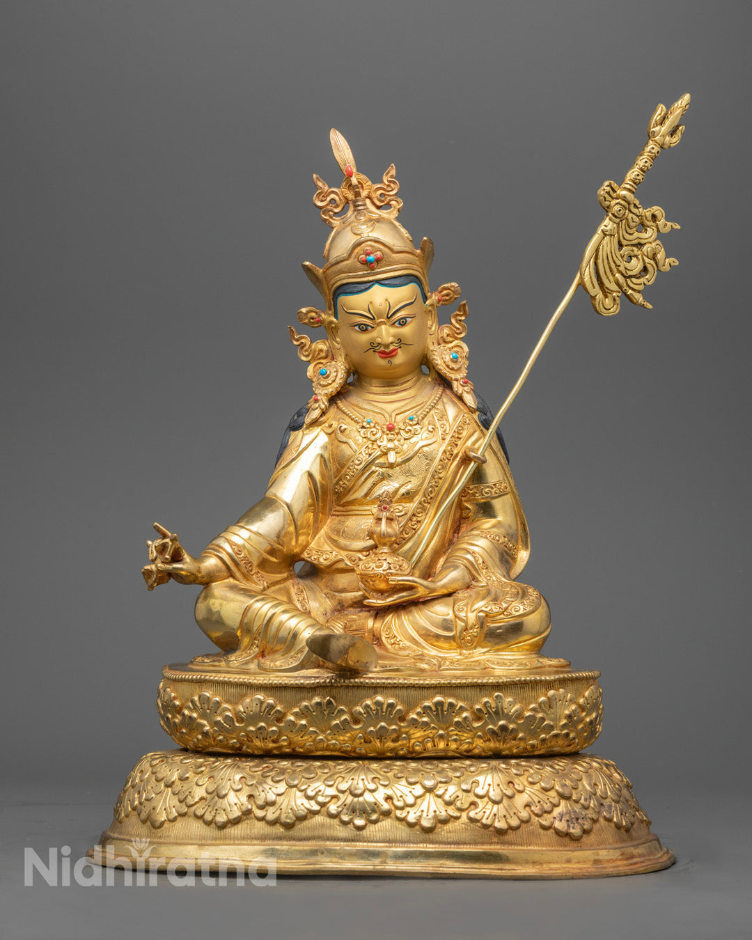 Handcrafted Padmasambhava Statue with 24K gold-gilded face and gold fire-gilded body, holding vajra, kapala, and trident – Tibetan Buddhist art