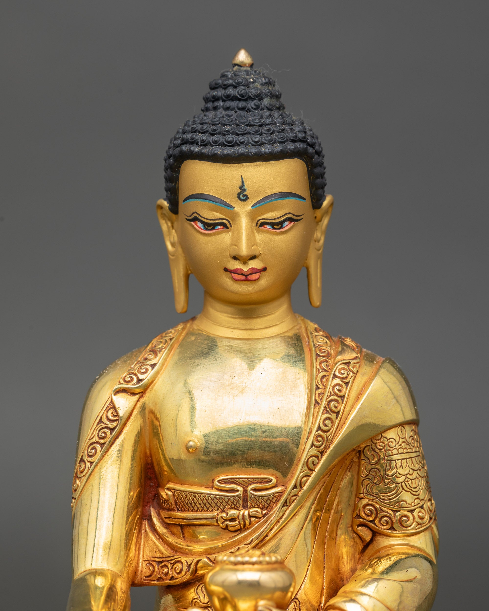 Handcrafted Shakyamuni Buddha sculpture showing begging bowl and detailed 3D carving