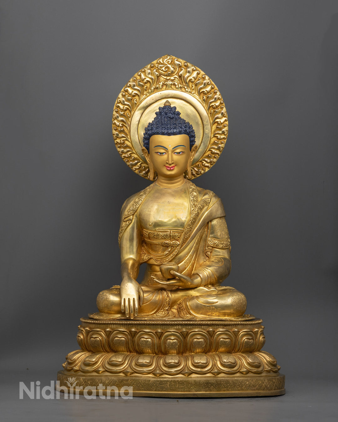 Handcrafted Shakyamuni Buddha statue in radiant 24K gold gilded copper, symbolizing peace, wisdom, and enlightenment, made by skilled Nepalese artisans.