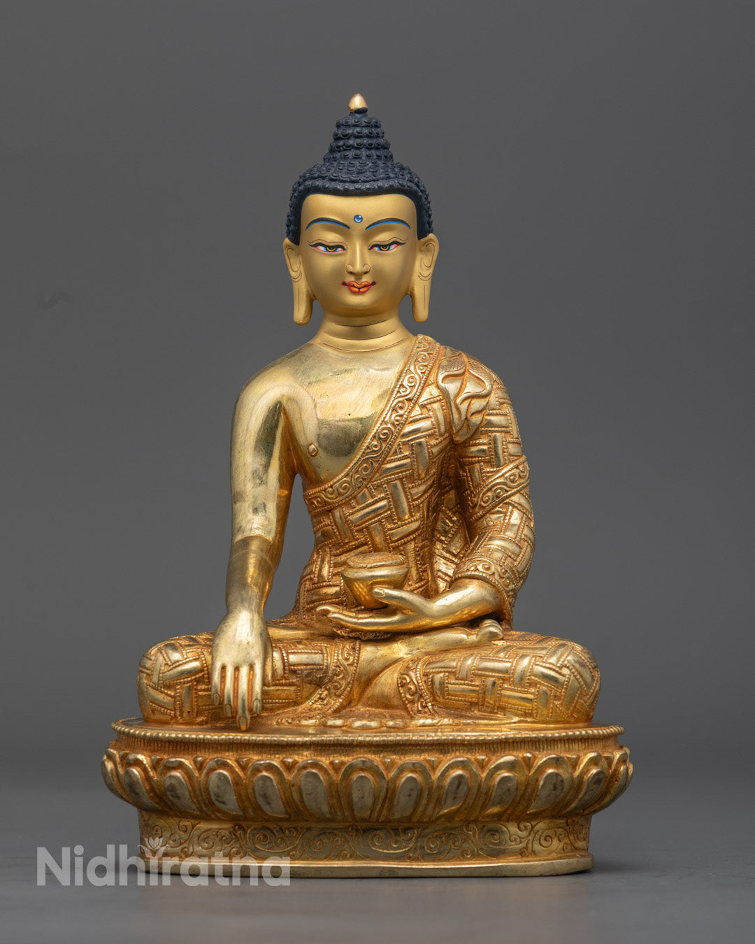 Handcrafted Shakyamuni Buddha statue seated on a lotus throne, gilded with 24k gold, representing the historical Buddha in meditation.