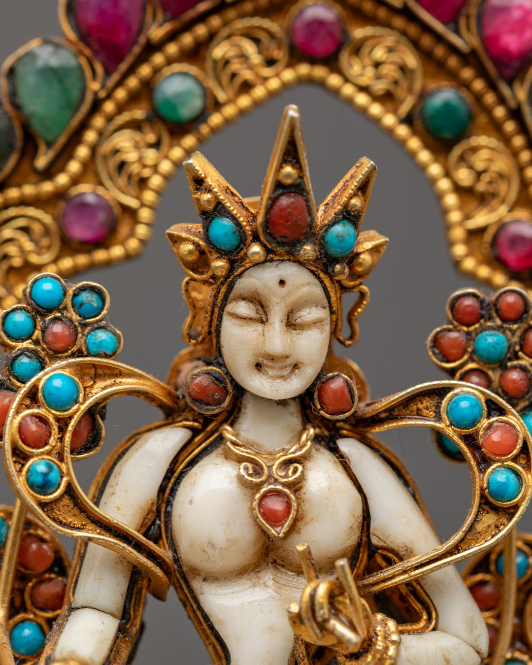 Handcrafted Tibetan Buddhist statue featuring detailed carvings on halo crown robe and throne adorned with shimmering semi-precious stones