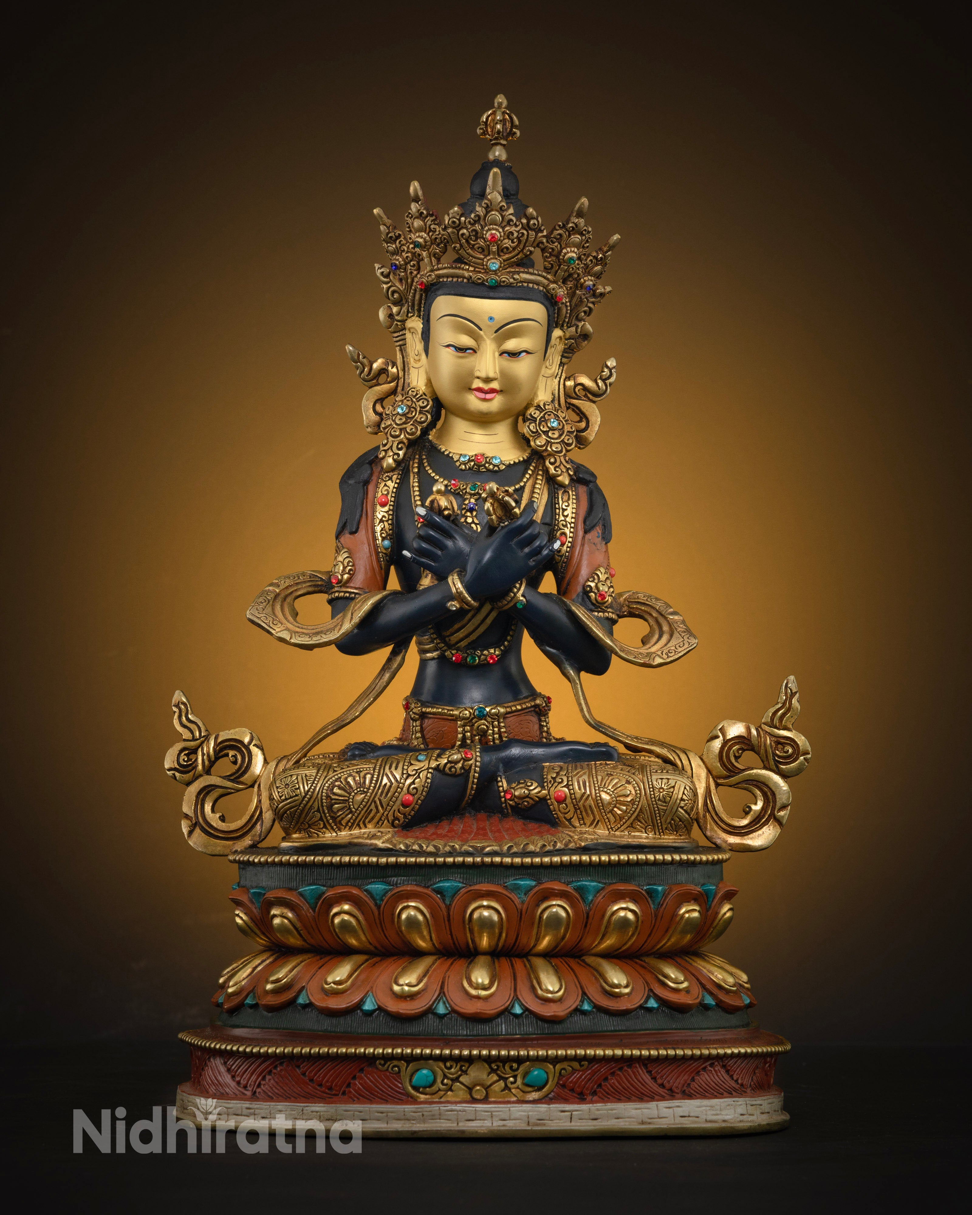 Handcrafted Vajradhara statue from Patan, Nepal, made of high-quality copper with a radiant 24k gold-plated face, vibrant acrylic colors, and semi-precious gem adornments.