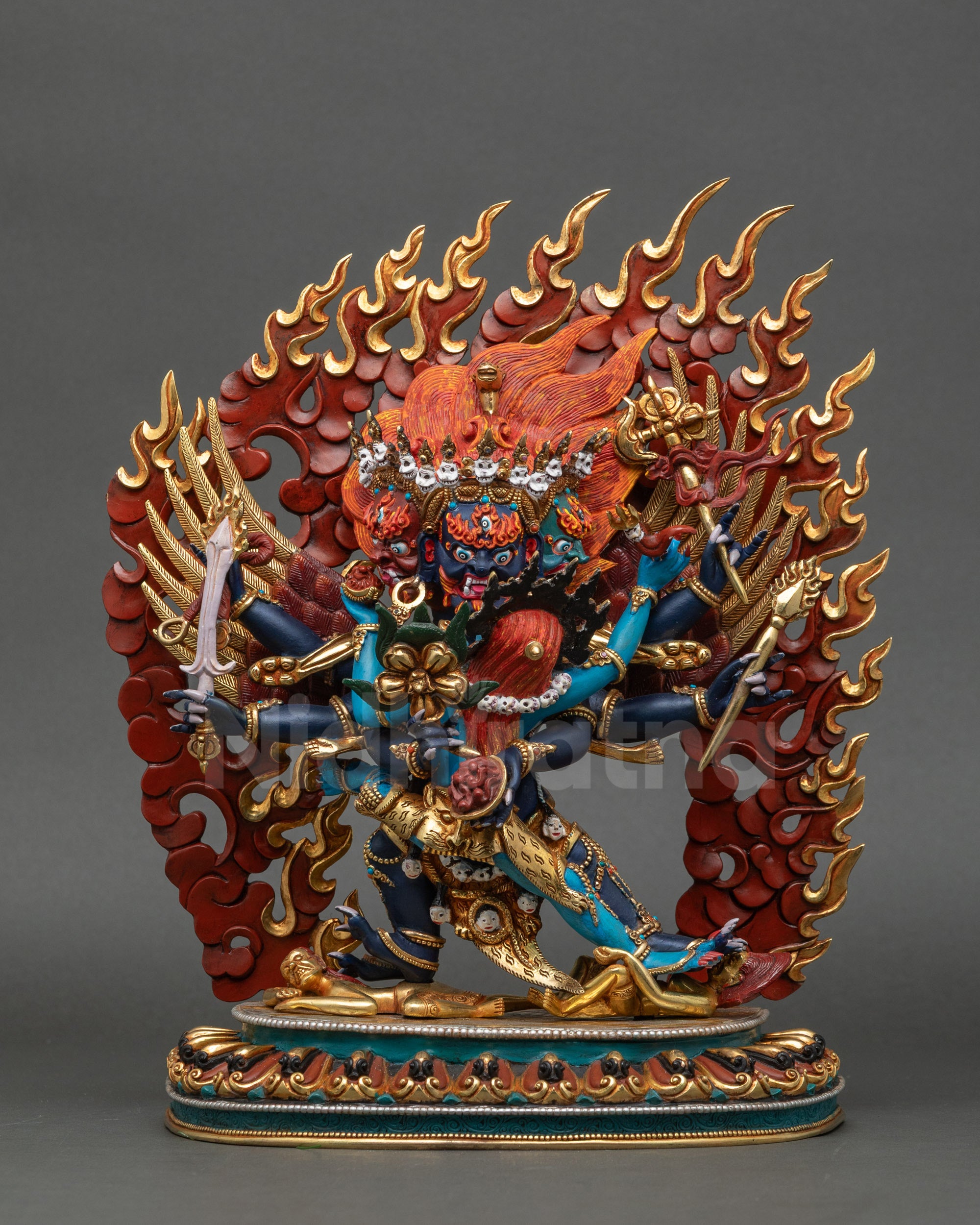 Horse-headed Hayagriva statue subduing two figures on lotus with blazing halo