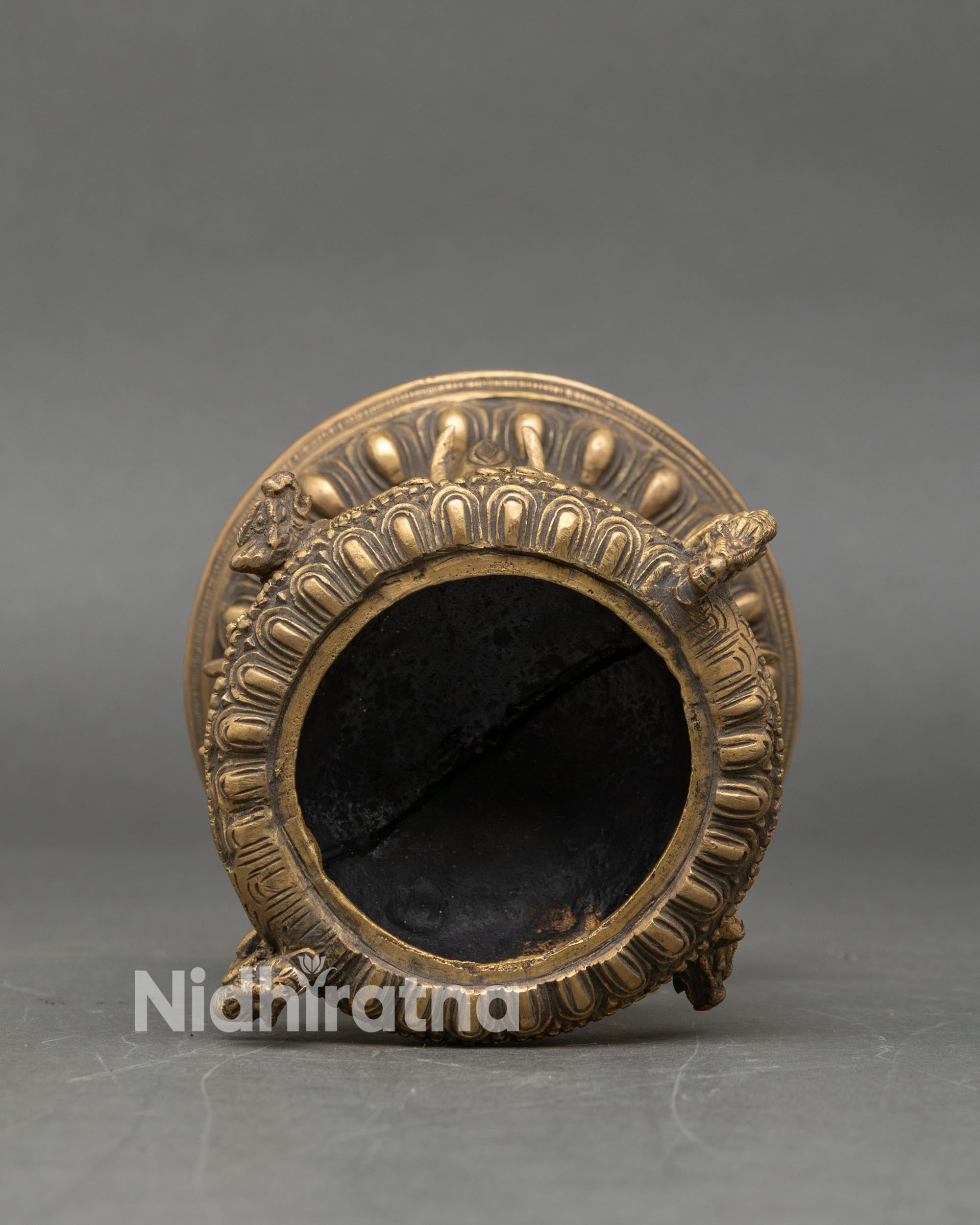 Interior view of brass incense burner lid opening handmade Buddhist ritual dhoop holder Nepal