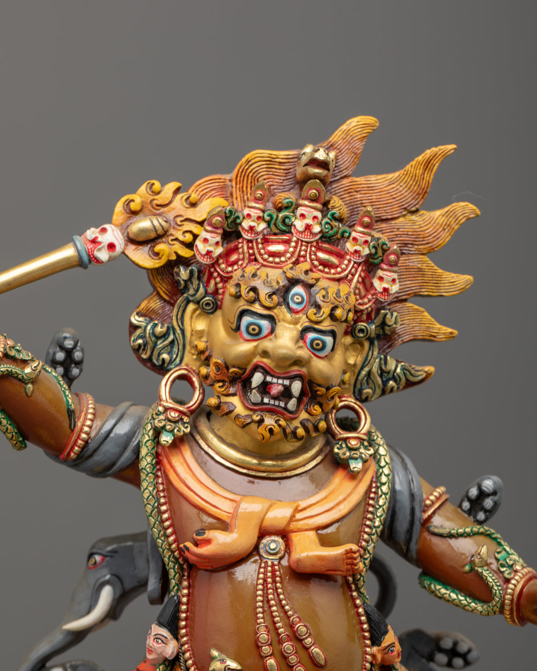 Intricate carvings on Tibetan Hayagriva Statue body showing serpent garland and acrylic colors