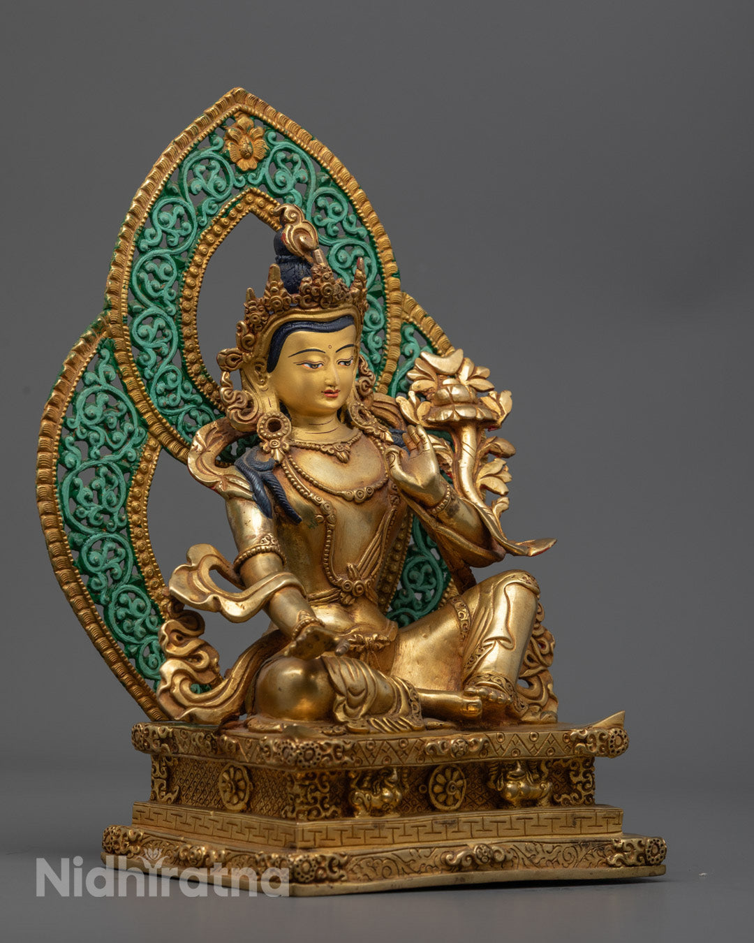 Intricate details of Sarvanivarana Vishkambhin artwork with colored halo, lotus base, and rich acrylic accents