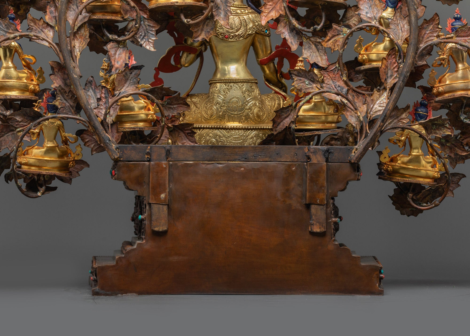 Intricate jewelry carvings semi-precious stone inlays on 21 Tara statues handcrafted Patan Nepal