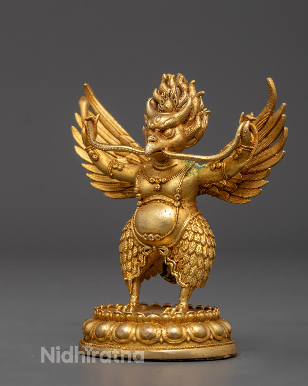 Intricately carved patka robe detail on handcrafted Garuda Statue made using ancient lost wax method
