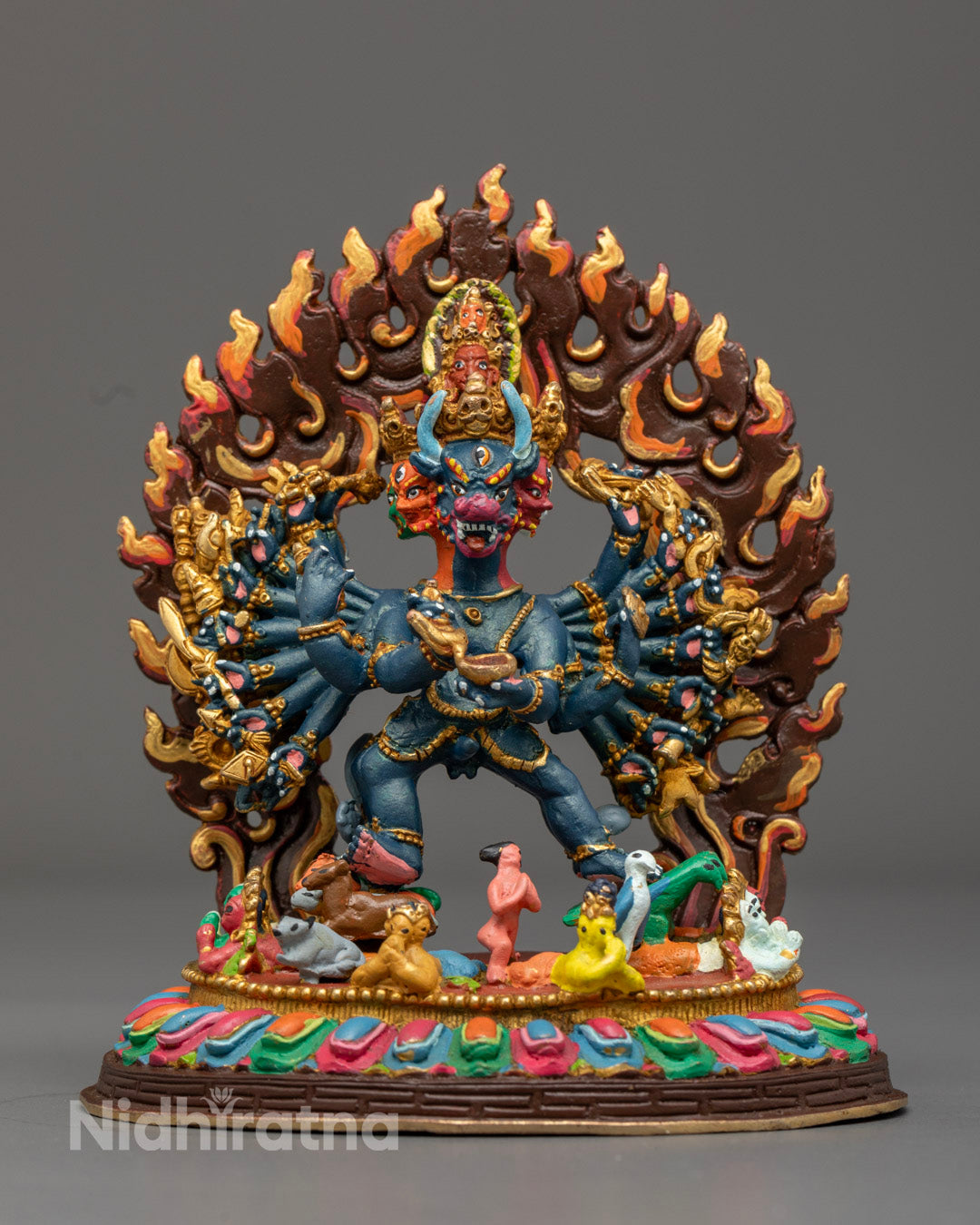 Intricately detailed Yamantaka Statue in copper with vibrant acrylic colors, showcasing wrathful deity features and hollow chamber for mantra placement.