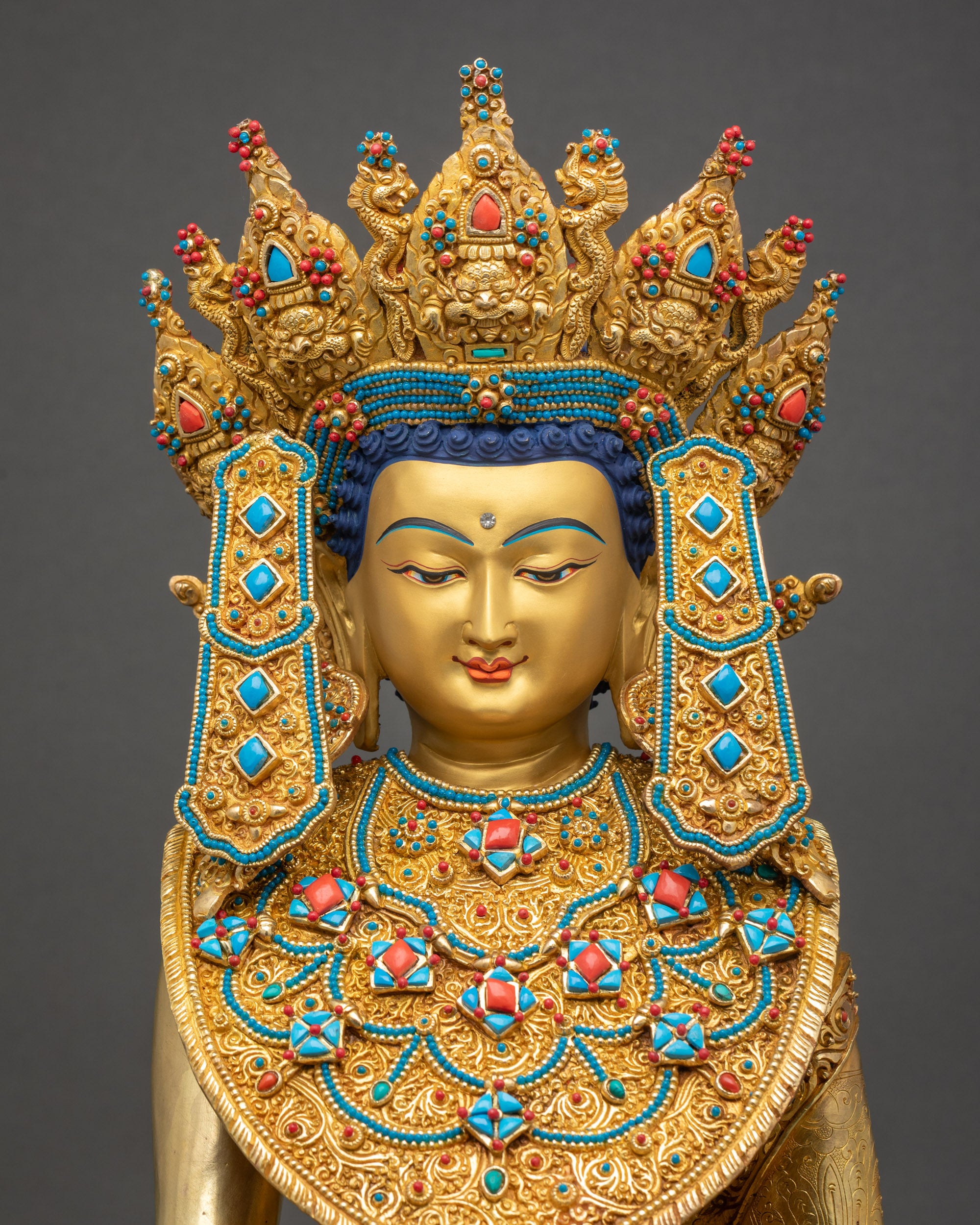 Close-up of Jowo Buddha Statueβs gold-gilded face, serene expression, handcrafted by Newari artisans.