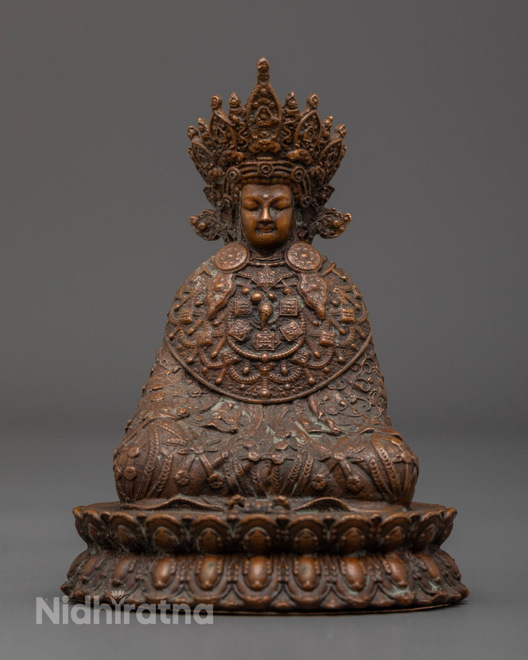 Jowo Shakyamuni Buddha Statue in meditative pose, handcrafted in oxidized copper with intricate detailing and antique finish.