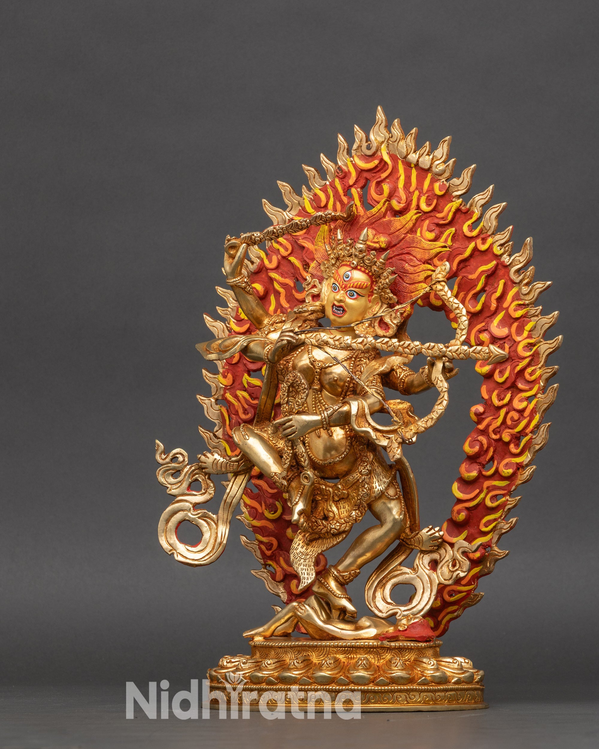 Kurukulla goddess statue surrounded by halo of flames, sacred Newari craftsmanship