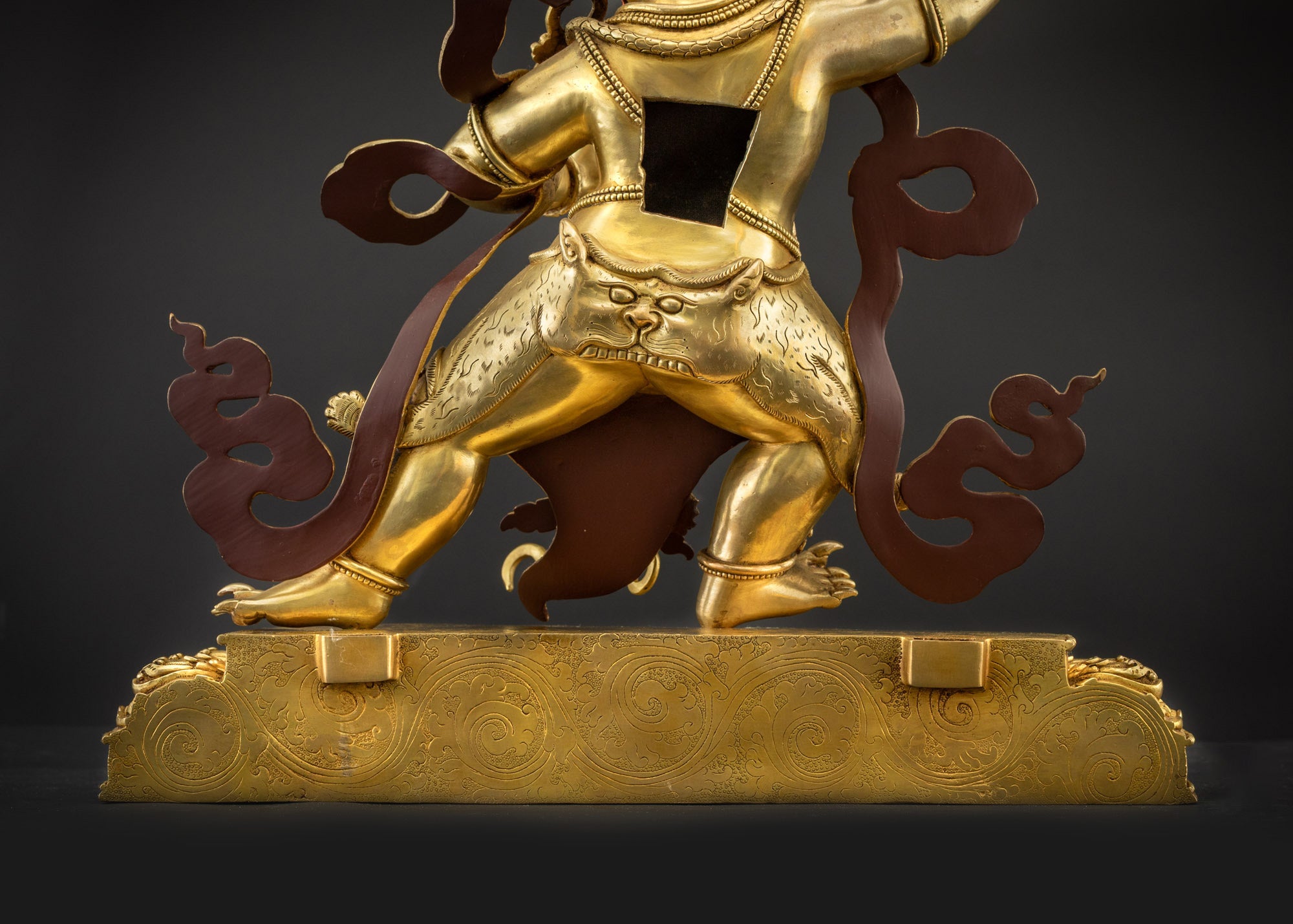 Landscape back view of Vajrapani statue showing halo and lotus