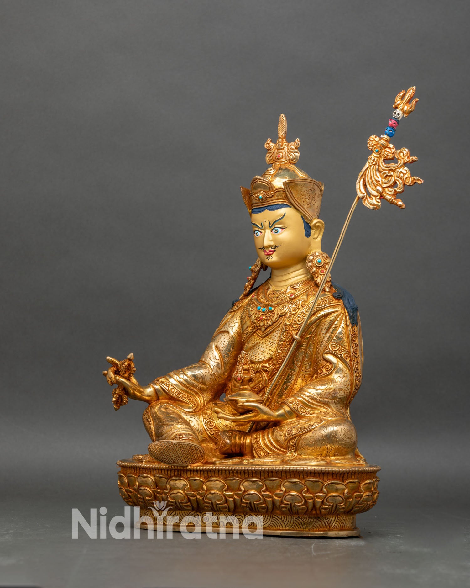 Left profile of Guru Rinpoche statue, copper and gold Padmasambhava artwork