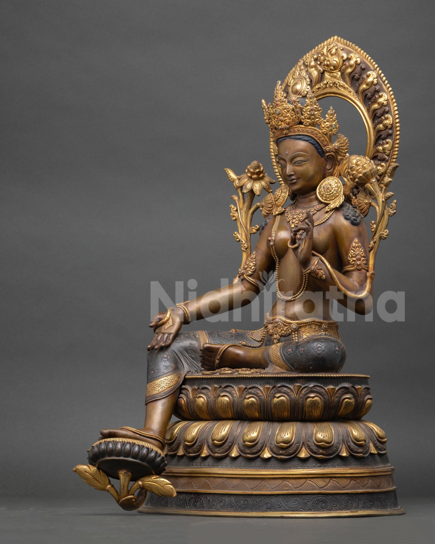 Left side view Green Tara statue, detailed ornaments, oxidized copper finish