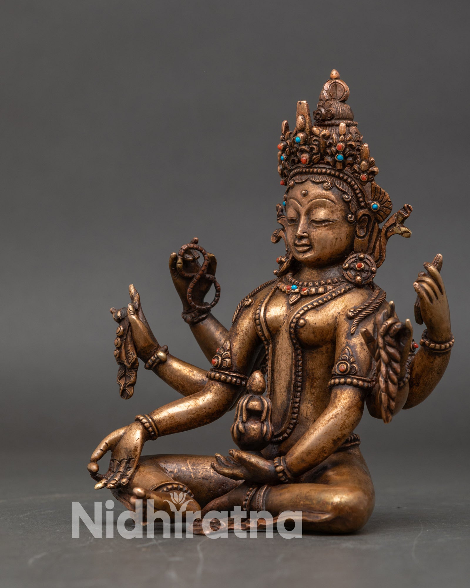 Left side view of Vasudhara statue depicting the Goddess of Wealth