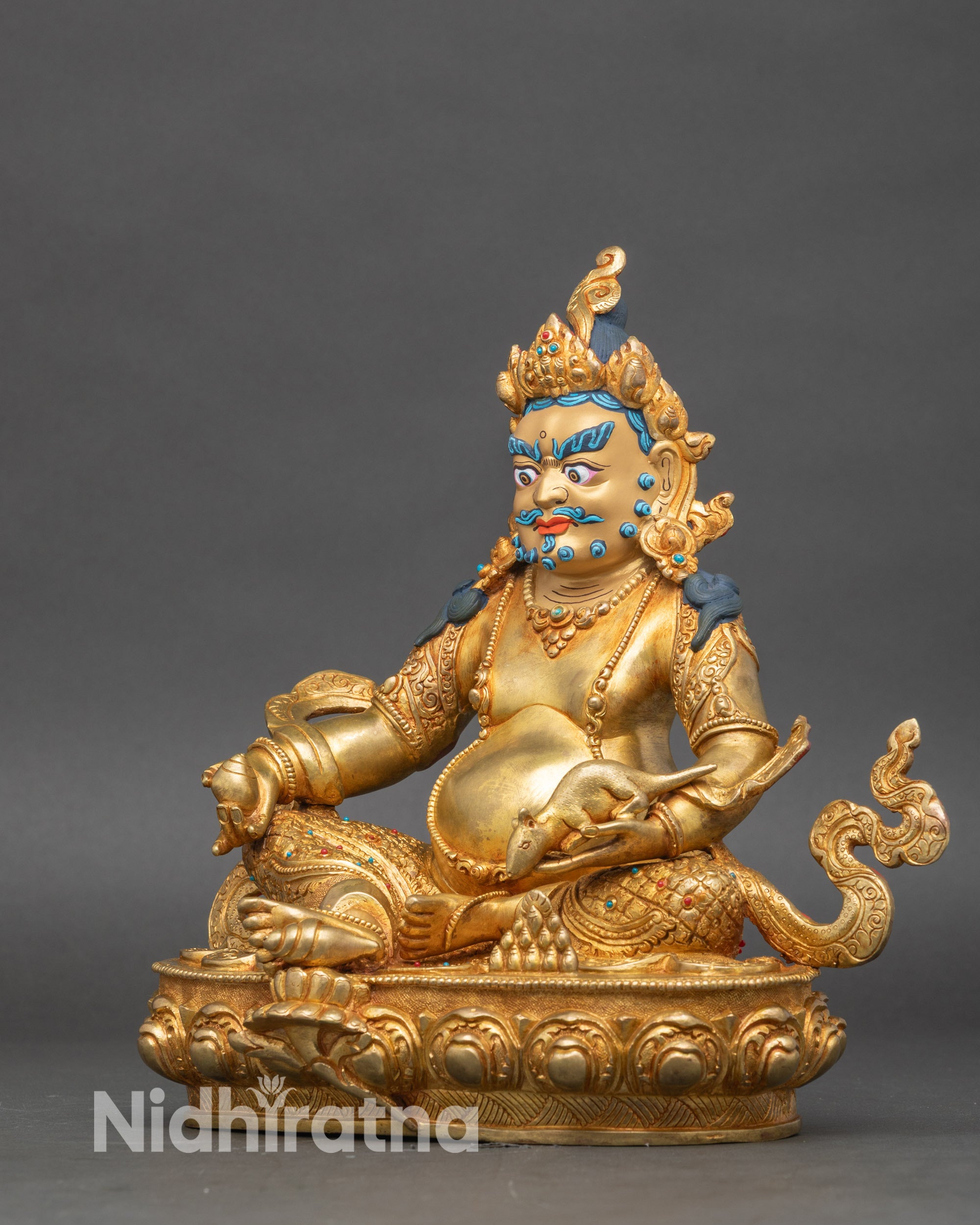 Left side view of Yellow Dzambhala, copper and gold handcrafted Buddhist deity