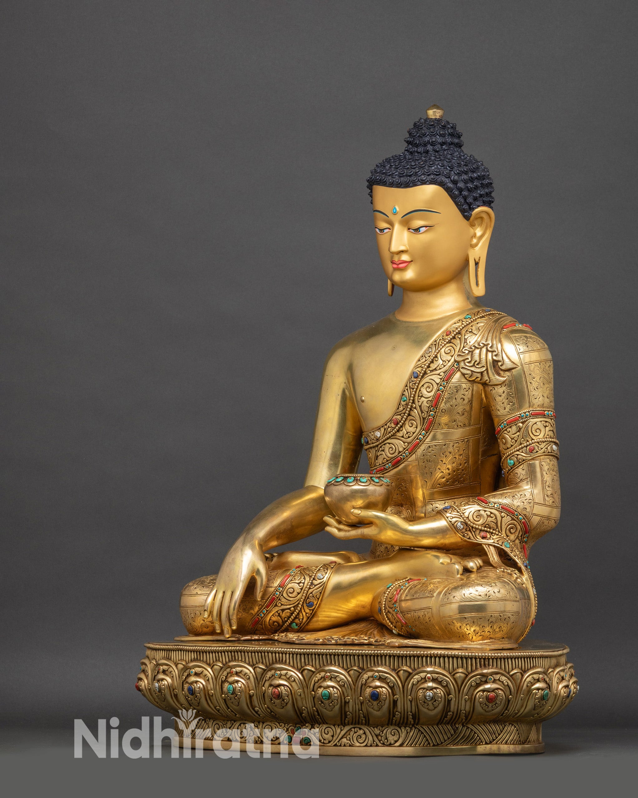 Left-side view of Shakyamuni Buddha statue, highlighting bhumisparsha mudra and lotus pedestal