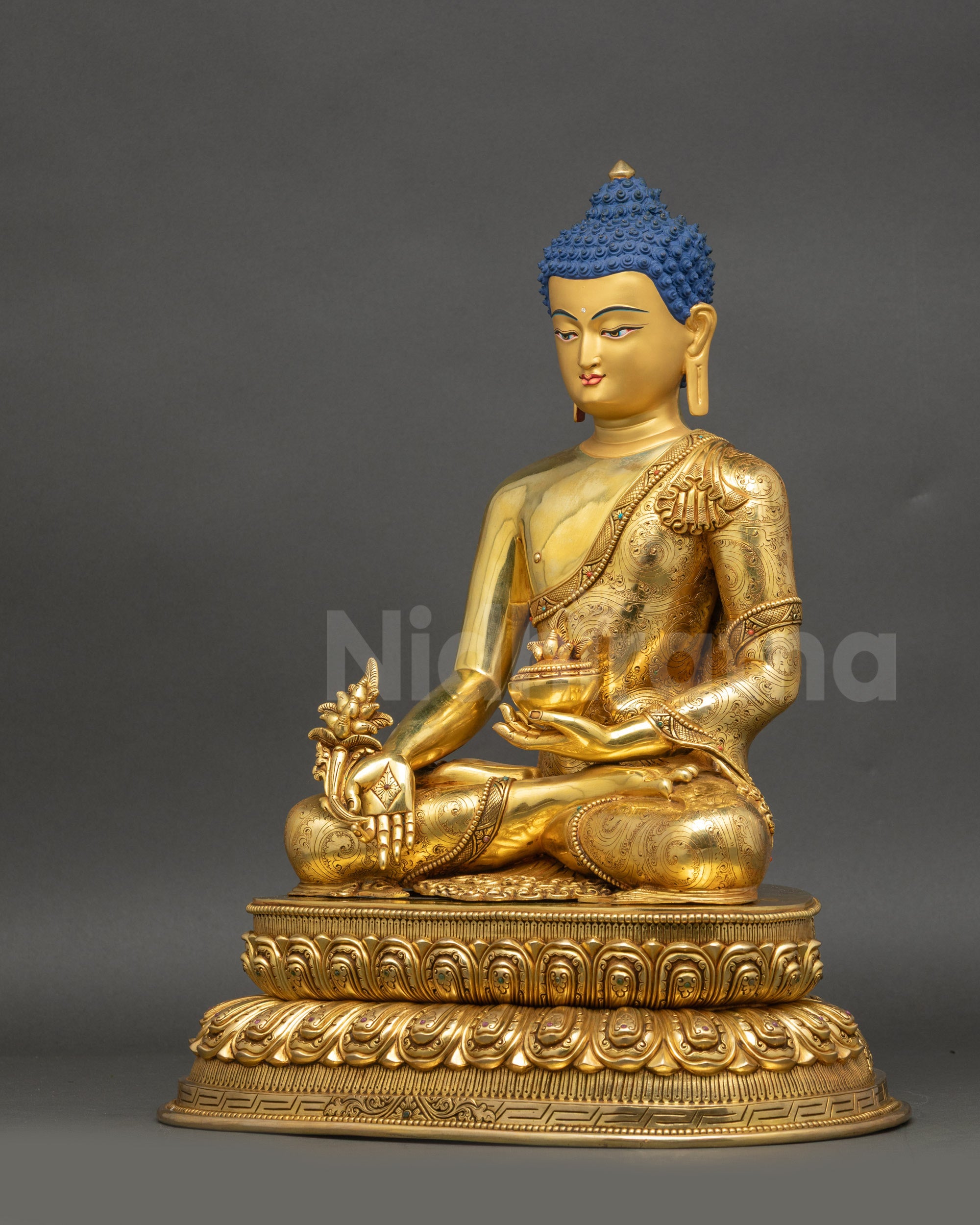 Left-side view of handcrafted Medicine Buddha showing gold-gilded copper and Dhyana Mudra