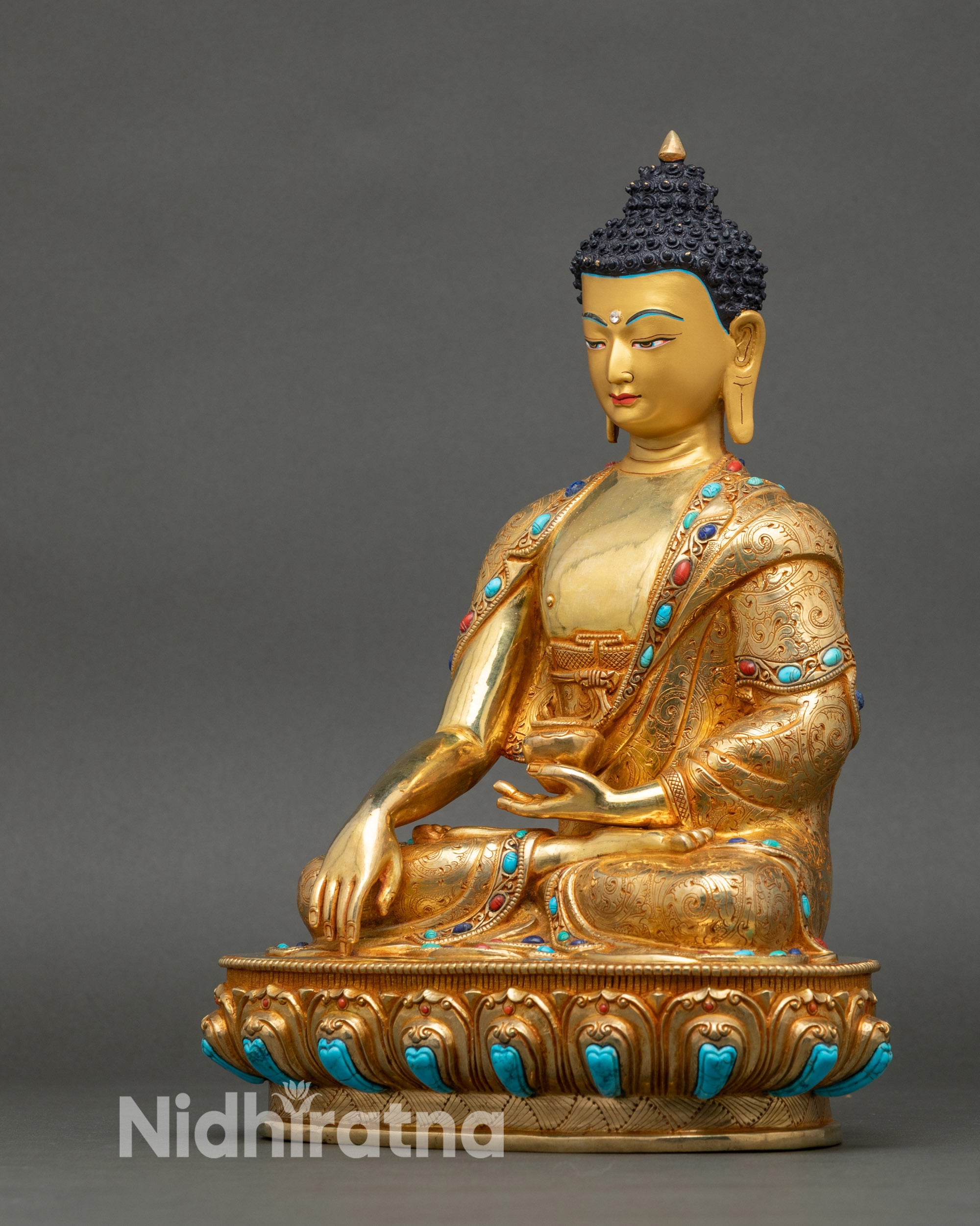 Left profile of Buddha sculpture with lotus seat and detailed floral carvings
