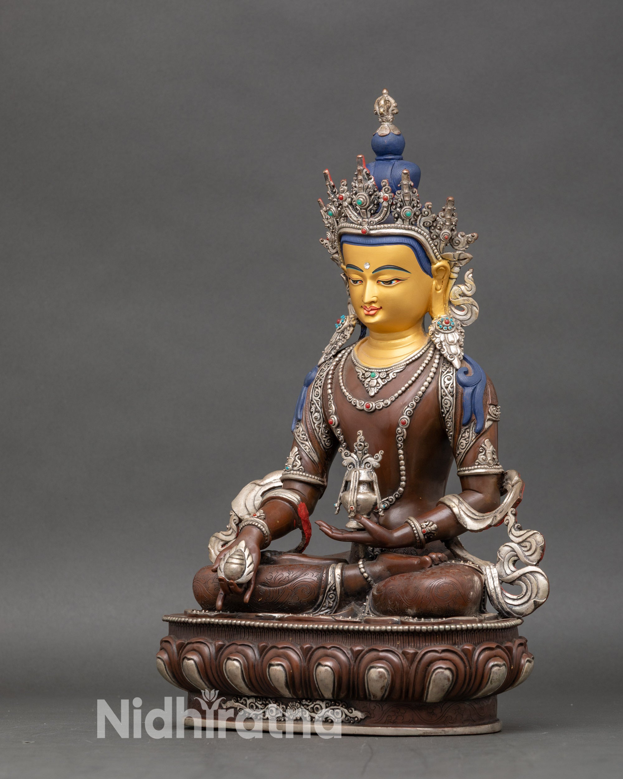 Left profile of Kshitigarbha Bodhisattva highlighting ornaments and posture