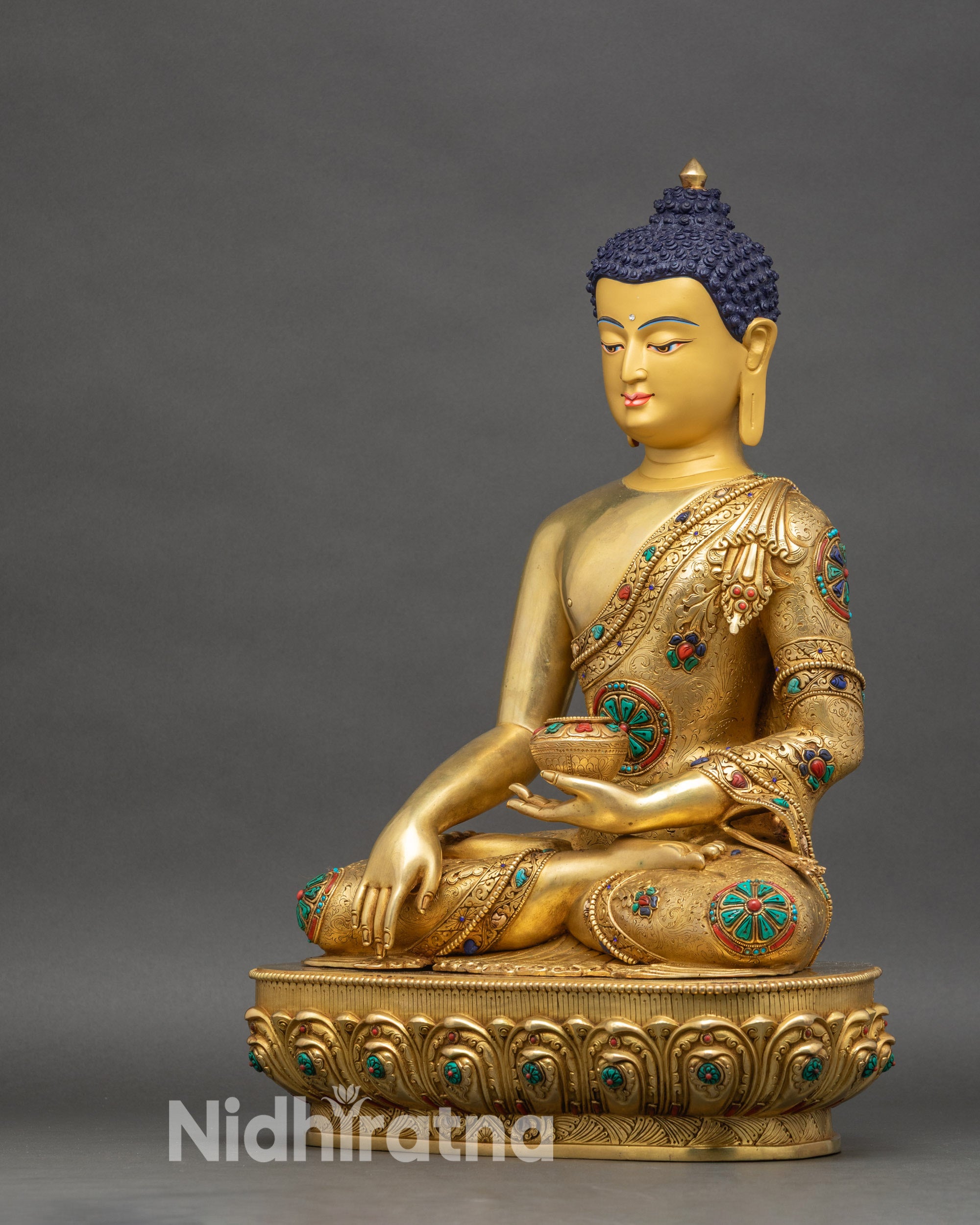 Left profile of Shakyamuni Buddha statue, detailed copper and gold craftsmanship