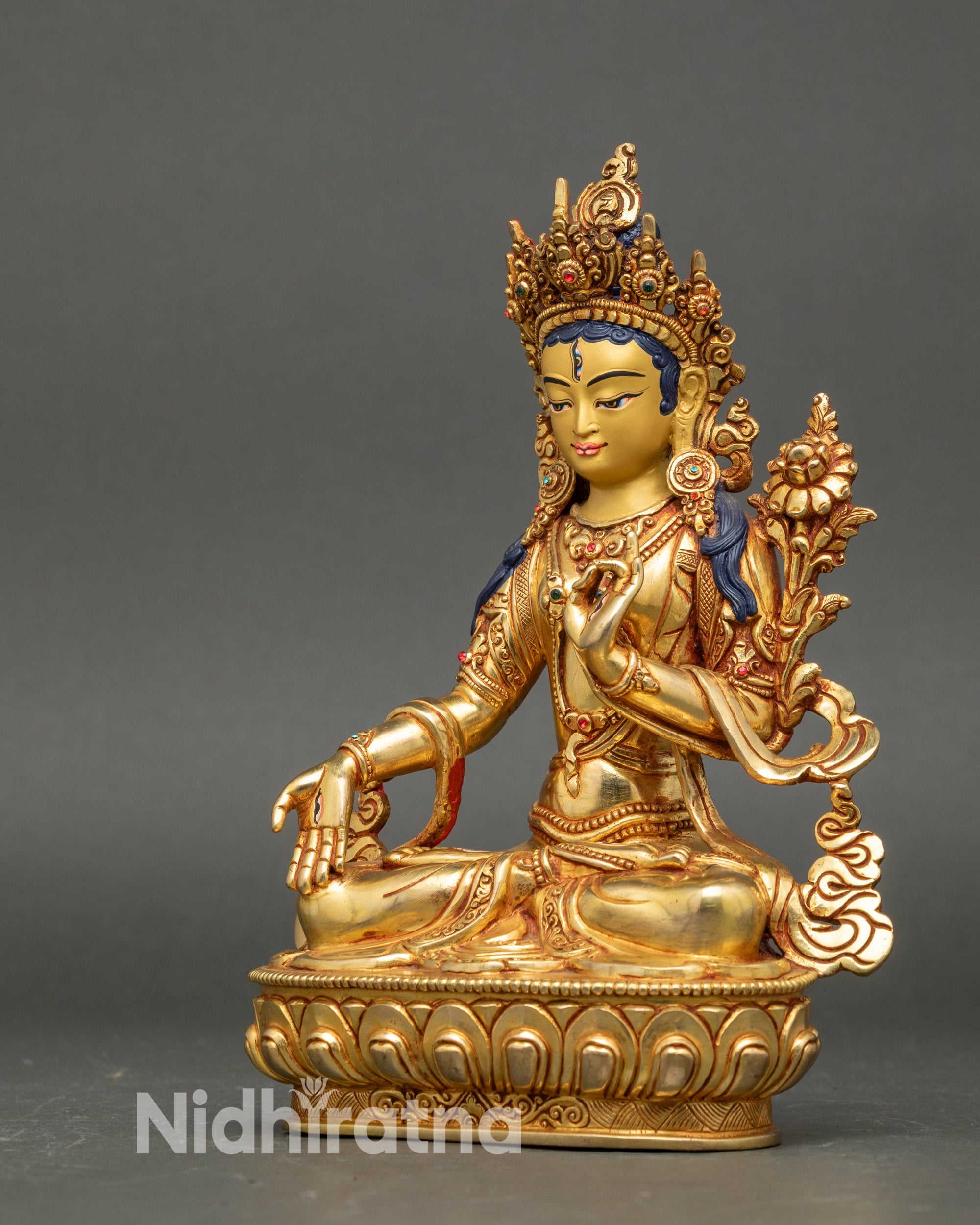 Left profile of White Tara statue, gold fire-gilded details with lotus throne